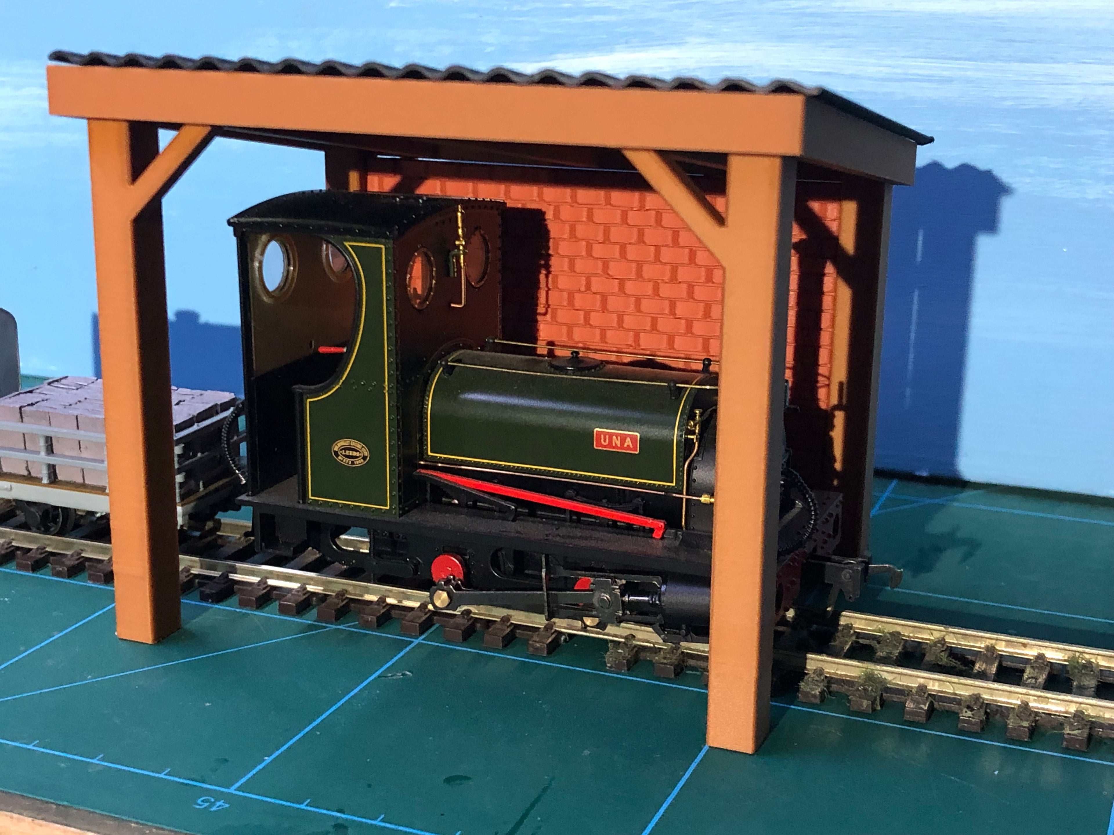 NG7 7mm scale engine stand model with corrugated roof, wooden sides and brick rear wall for ON30 narrow gauge layouts