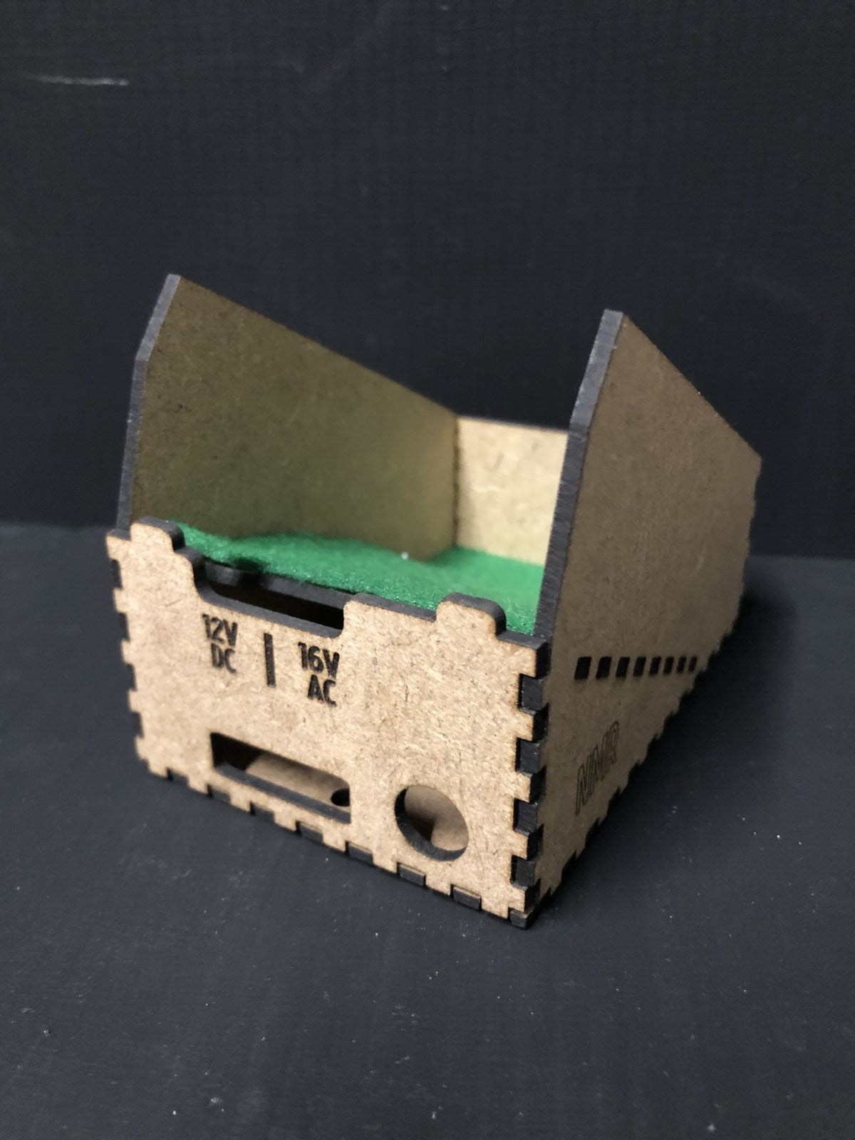 OO9 scale desktop caddy kit holding a Gaugemaster Combi model railway controller with cable cutouts and fixing holes