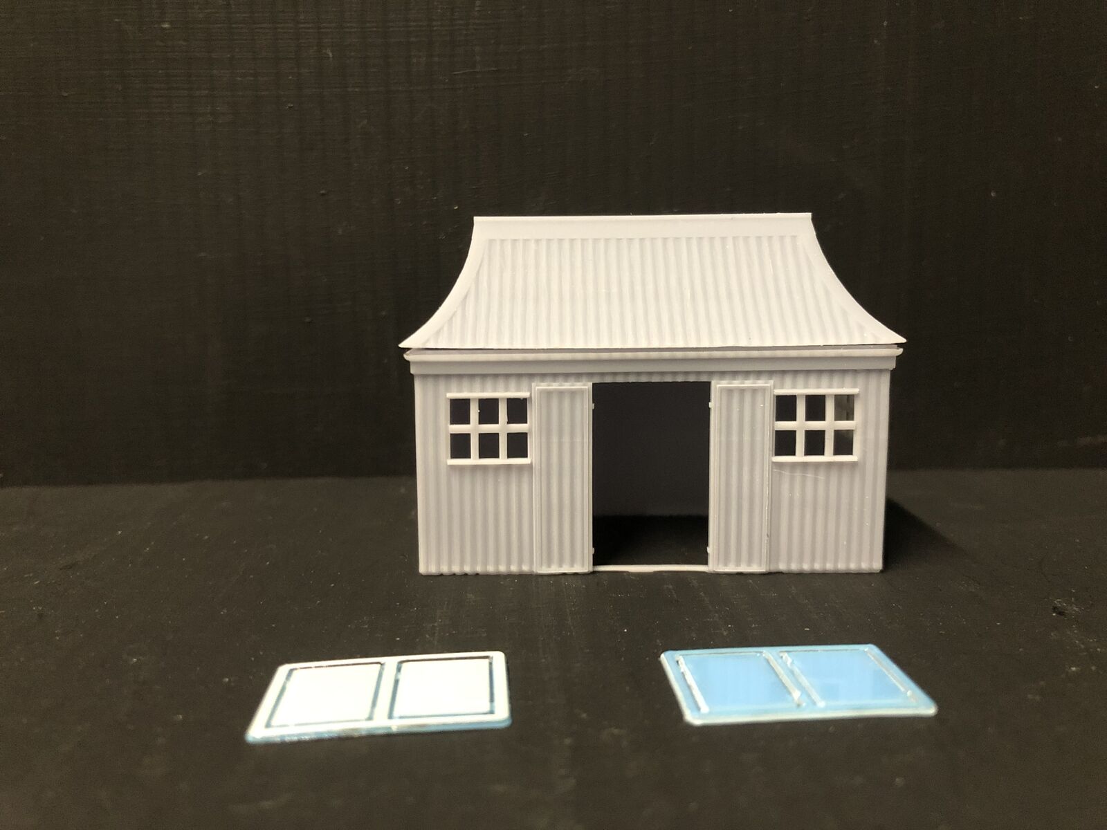 OO9/OO/HO scale GWR pagoda-style waiting room kit with open doors and glazing, based on the Glyndyfrdwy station building