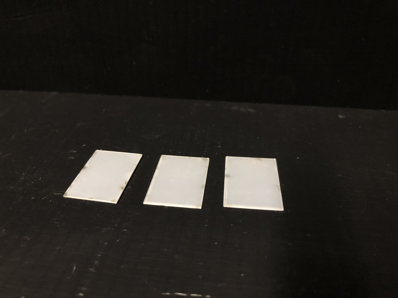 OO9 gauge Edwardian promenade shelter kit with glazed roof panels and two pedestrian figures for seaside or park model railway scenes