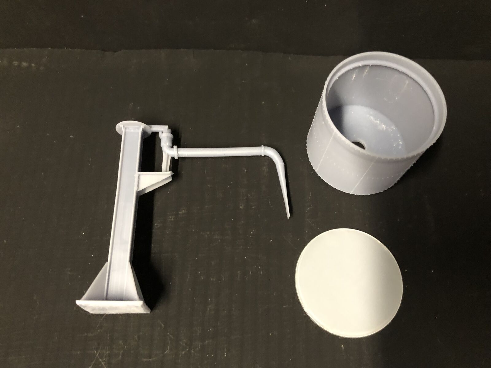 OO9 gauge GWR-style Buckfastleigh-inspired water tower kit with elevated tank and tower stand for model railway layouts