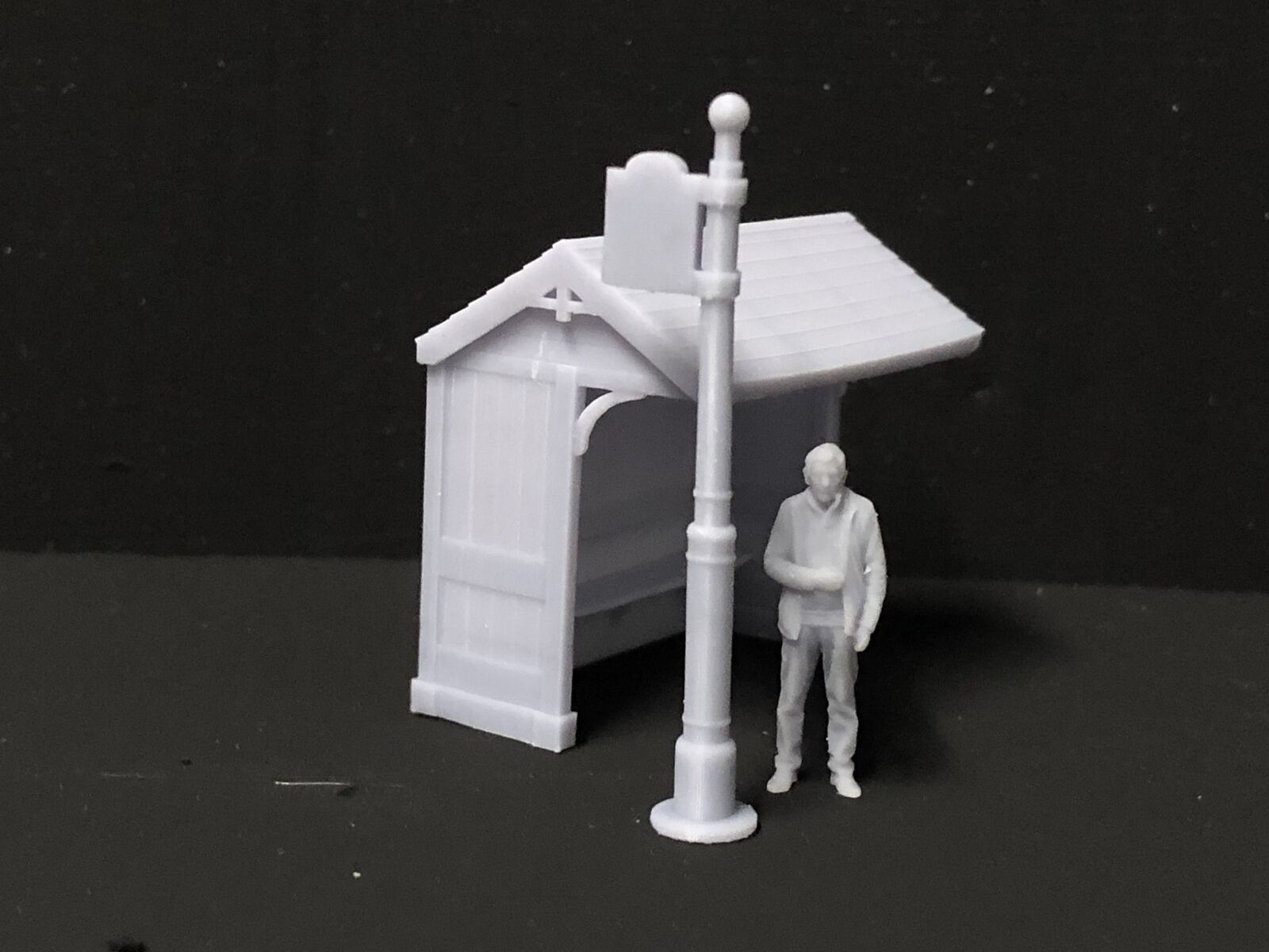 OO9/OO/HO scale model railway kit with two country bus shelters and matching station bus stop flags