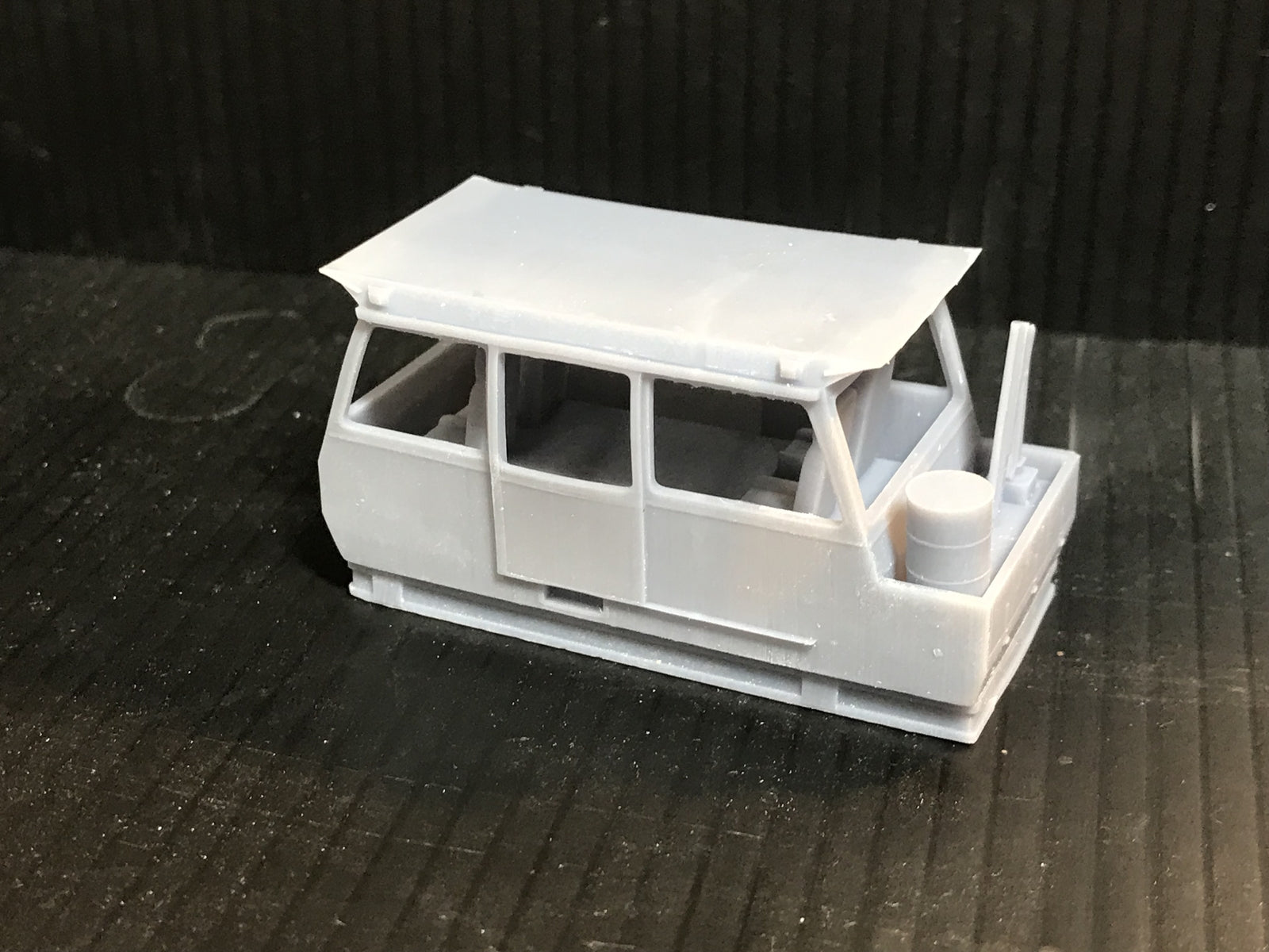 Unpainted OO9 narrow gauge Wickham inspection car body kit with interior for Kato 11-109 chassis, shown ready for assembly
