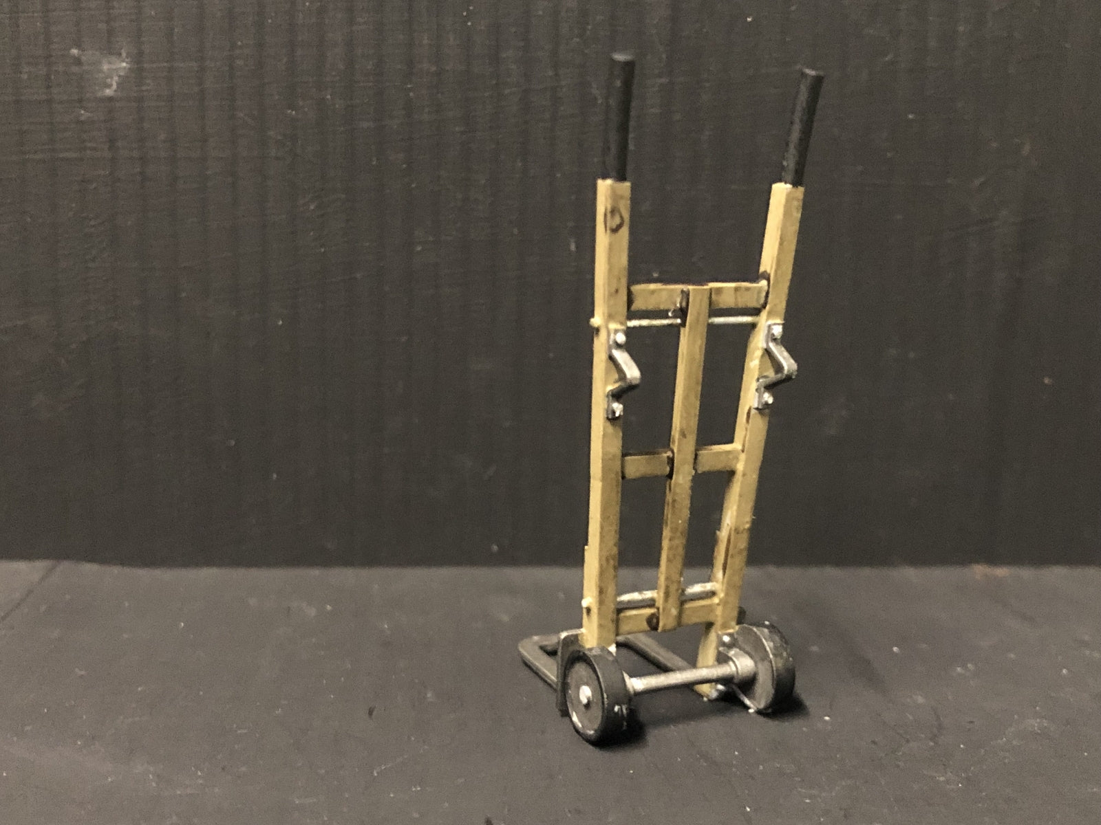 Unpainted GN15 G scale resin sack trolleys pair for model railway platforms or workshops, shown in grey ready for priming