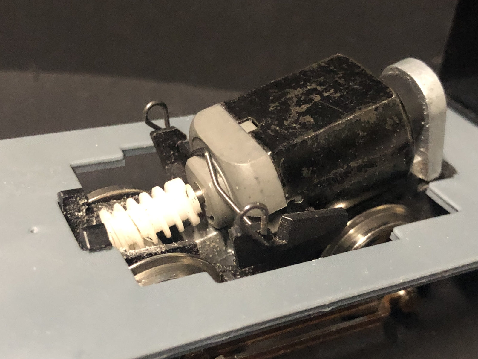 Close-up of a 5-pole 12V motor upgrade for Hornby Smokey Joe 0-4-0 OO gauge chassis, showing shaft ready for worm gear fitting