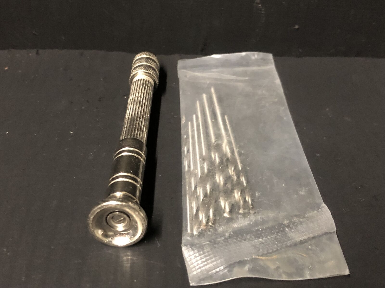 Pin vice drill holder set for railway modellers, shown with reversible collets and assorted micro drill bits for fine detailing.