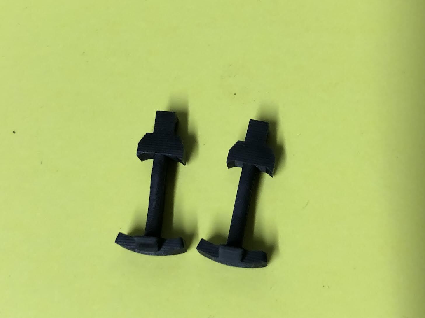 Set of four pairs of OO9 narrow gauge hook couplings shown for Kato 11-109 model railway chassis conversion