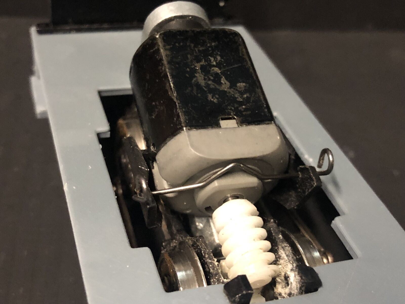 Close-up of a 5-pole 12V replacement motor for Hornby Smokey Joe 0-4-0 OO gauge chassis, showing the shaft and wiring terminals