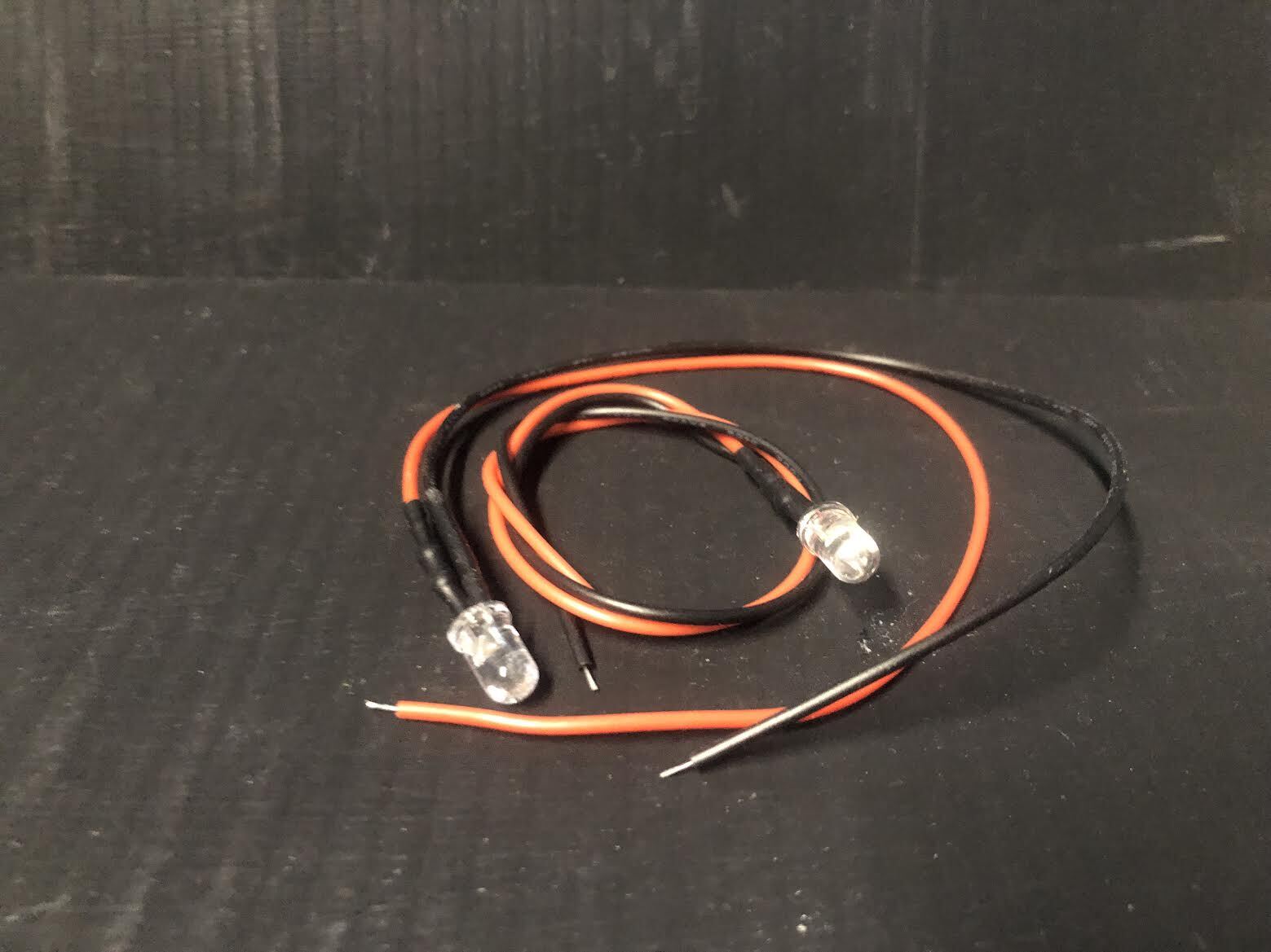 G-scale model railway scenery kit showing a resin brazier with flickering LEDs and a plastic chair, also suitable for GN15 layouts