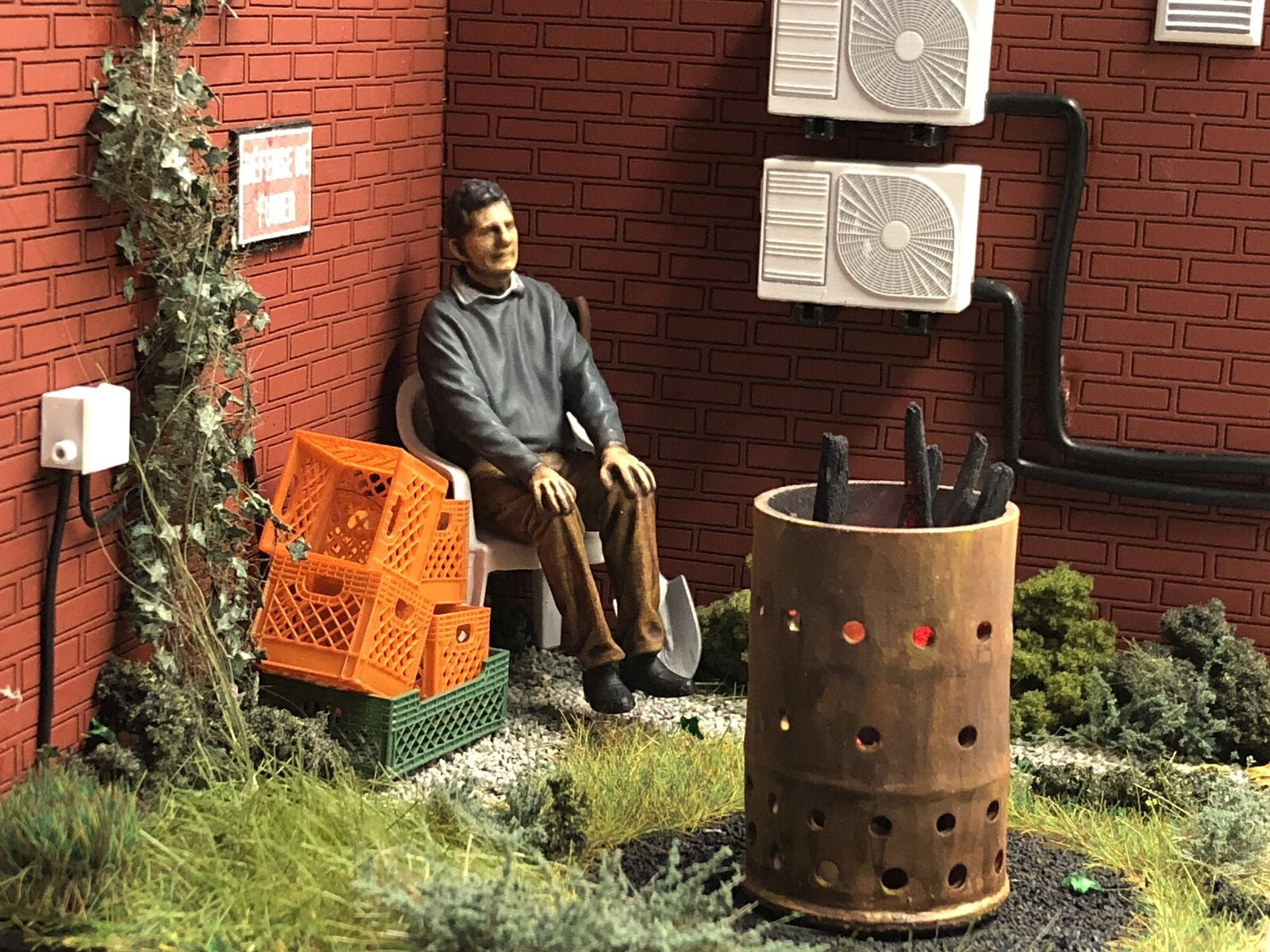 G-scale model railway scenery kit featuring a resin brazier with flickering LEDs and a chair, suitable for G and GN15 layouts