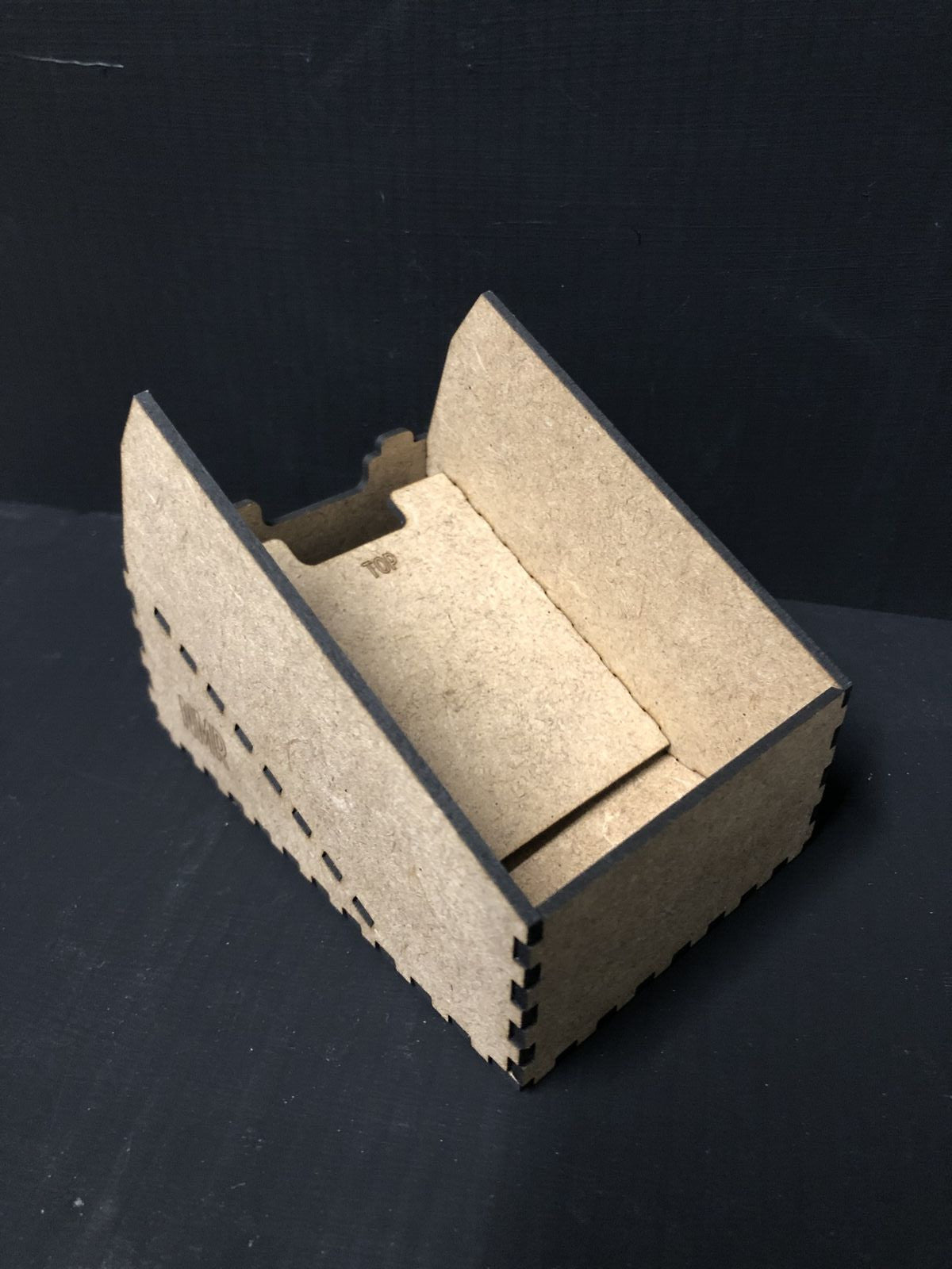 OO9 scale desktop caddy kit holding a Gaugemaster Combi model railway controller with cable cutouts and fixing holes