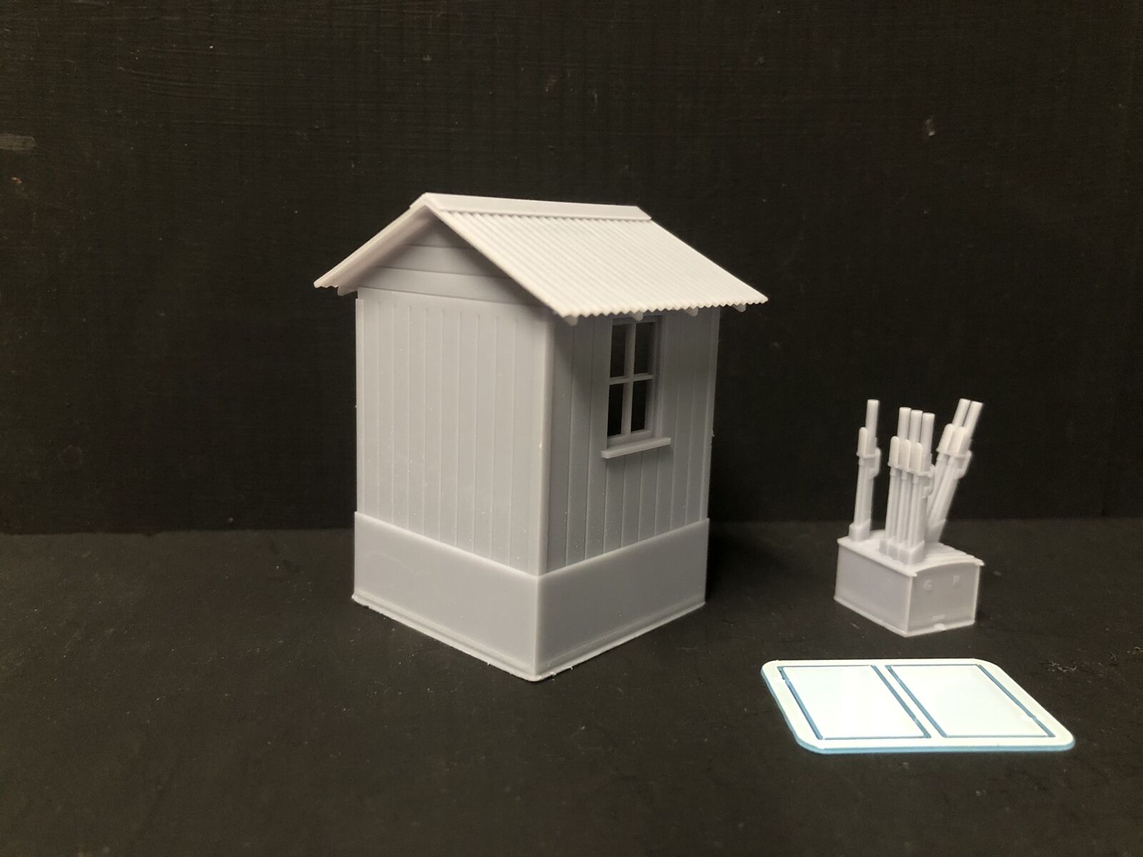 7mm scale NG7 model railway signalman’s hut kit with separate roof, glazing and interior lever frame on a narrow gauge layout