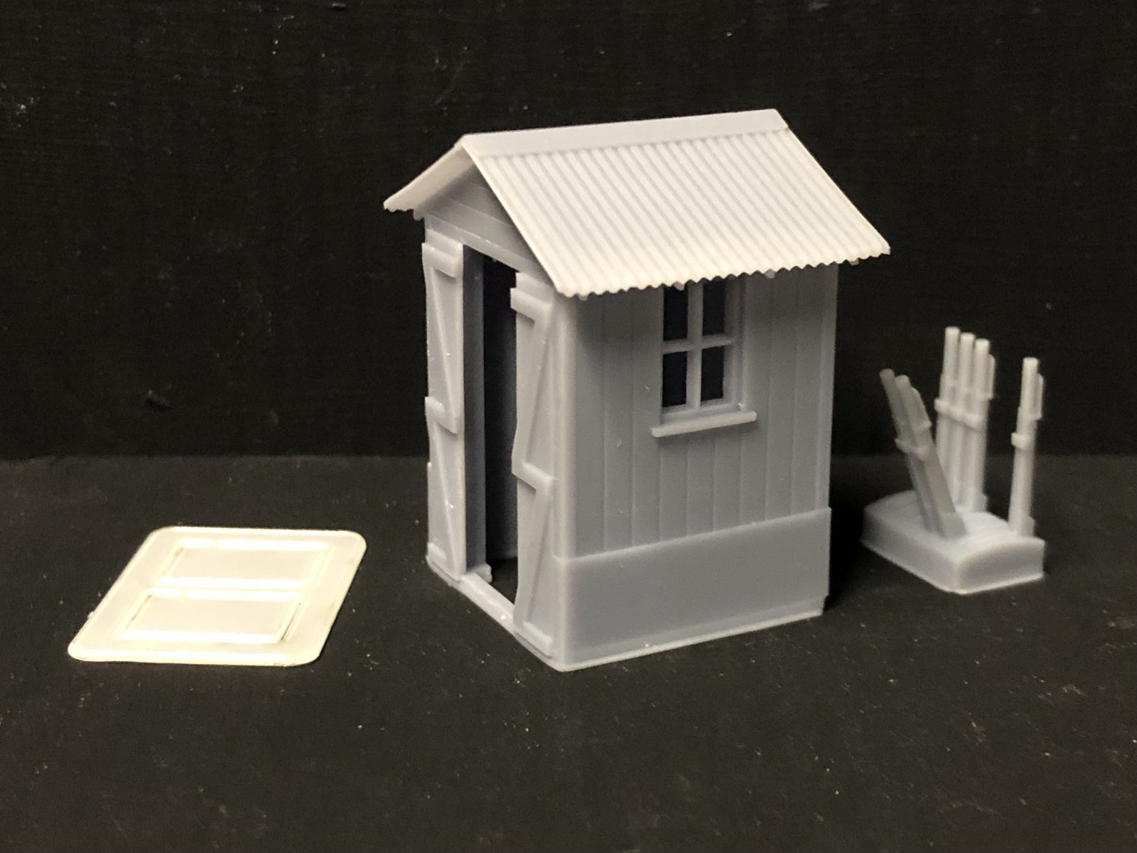 Unpainted OO9/OO/HO resin signalman’s hut kit with separate roof, glazing and lever frame for model railway layouts