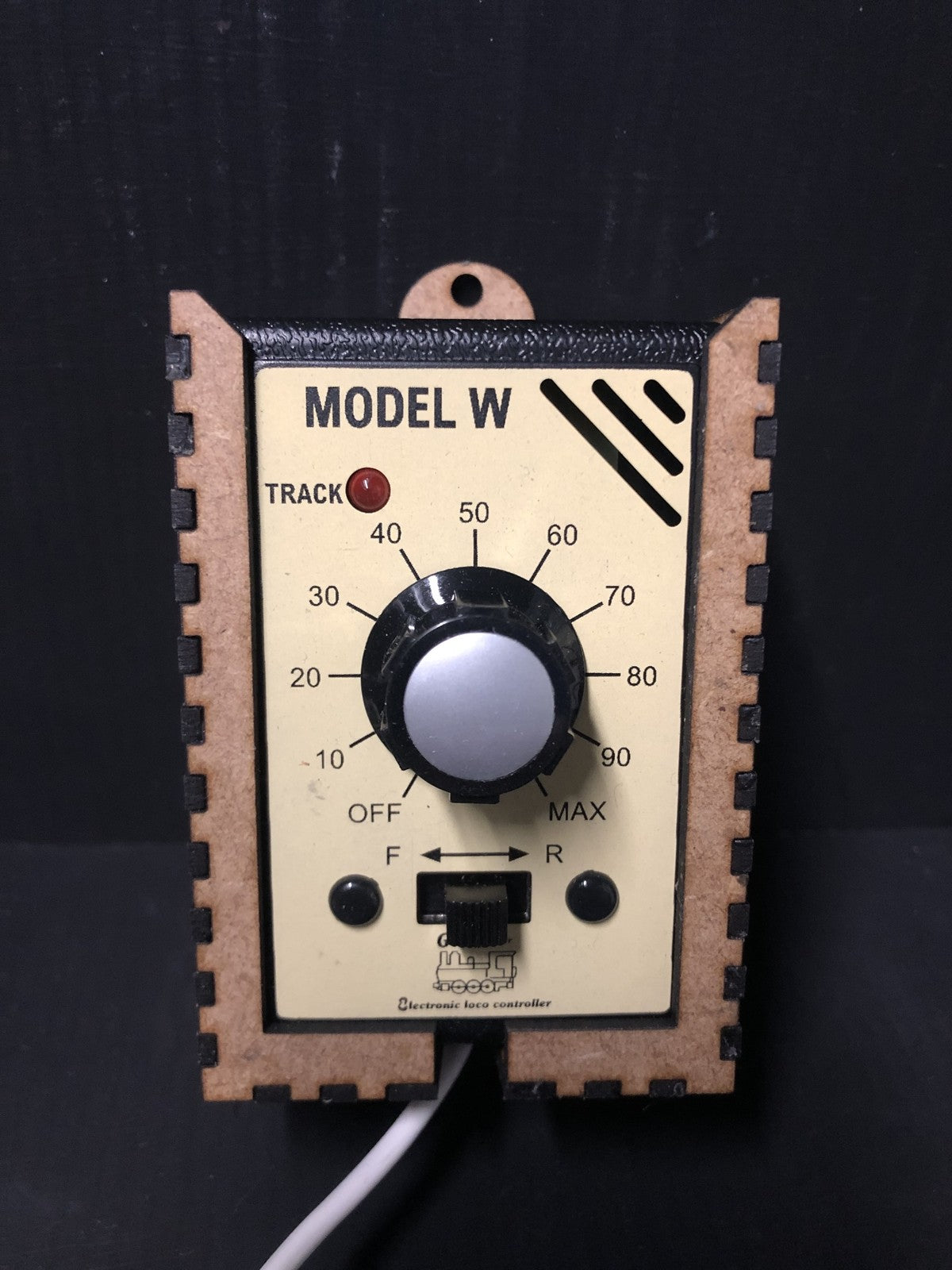 Plastic model railway caddy kit holding a GMC-W walkabout controller for shelf and diorama layouts