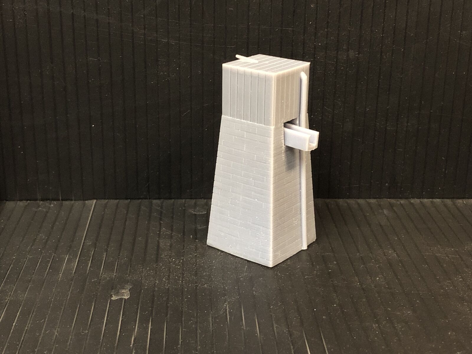 OO9 gauge Dolgoch-style model railway water tower kit with slate brick tower and top-mounted tank