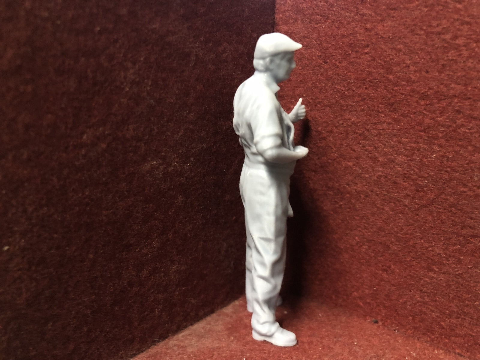 Unpainted 16mm 1:19 scale SM32 driver figure in flat cap giving a thumbs up for garden railway layouts