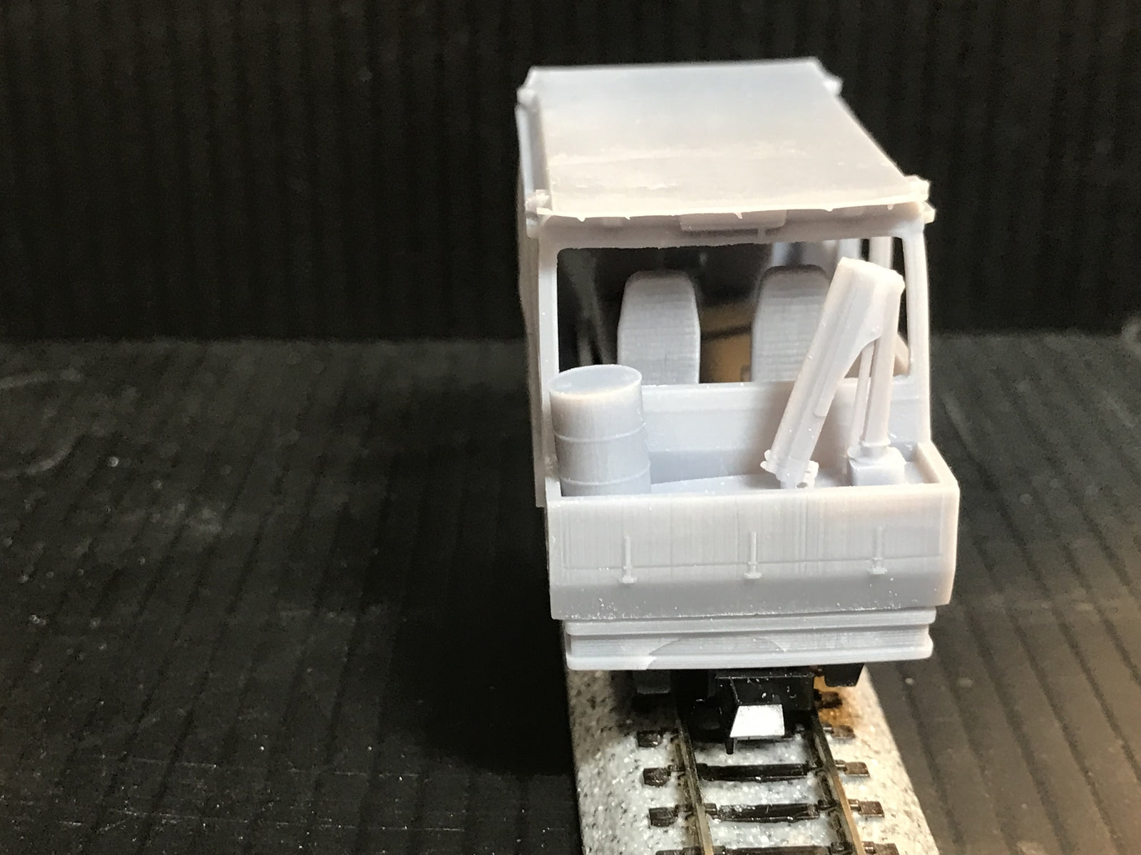 Unpainted OO9 narrow gauge Wickham inspection car kit body with interior for Kato 11-109 chassis, shown ready for assembly