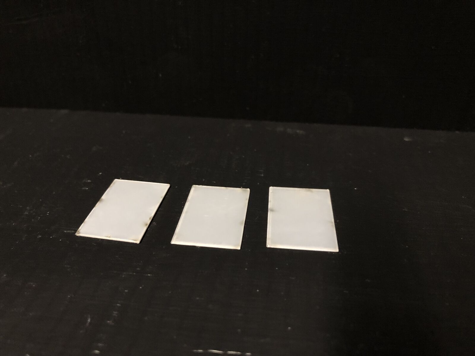 OO9 gauge Edwardian promenade shelter kit with glazed roof panels and two pedestrian figures for seaside or park model railway scenes