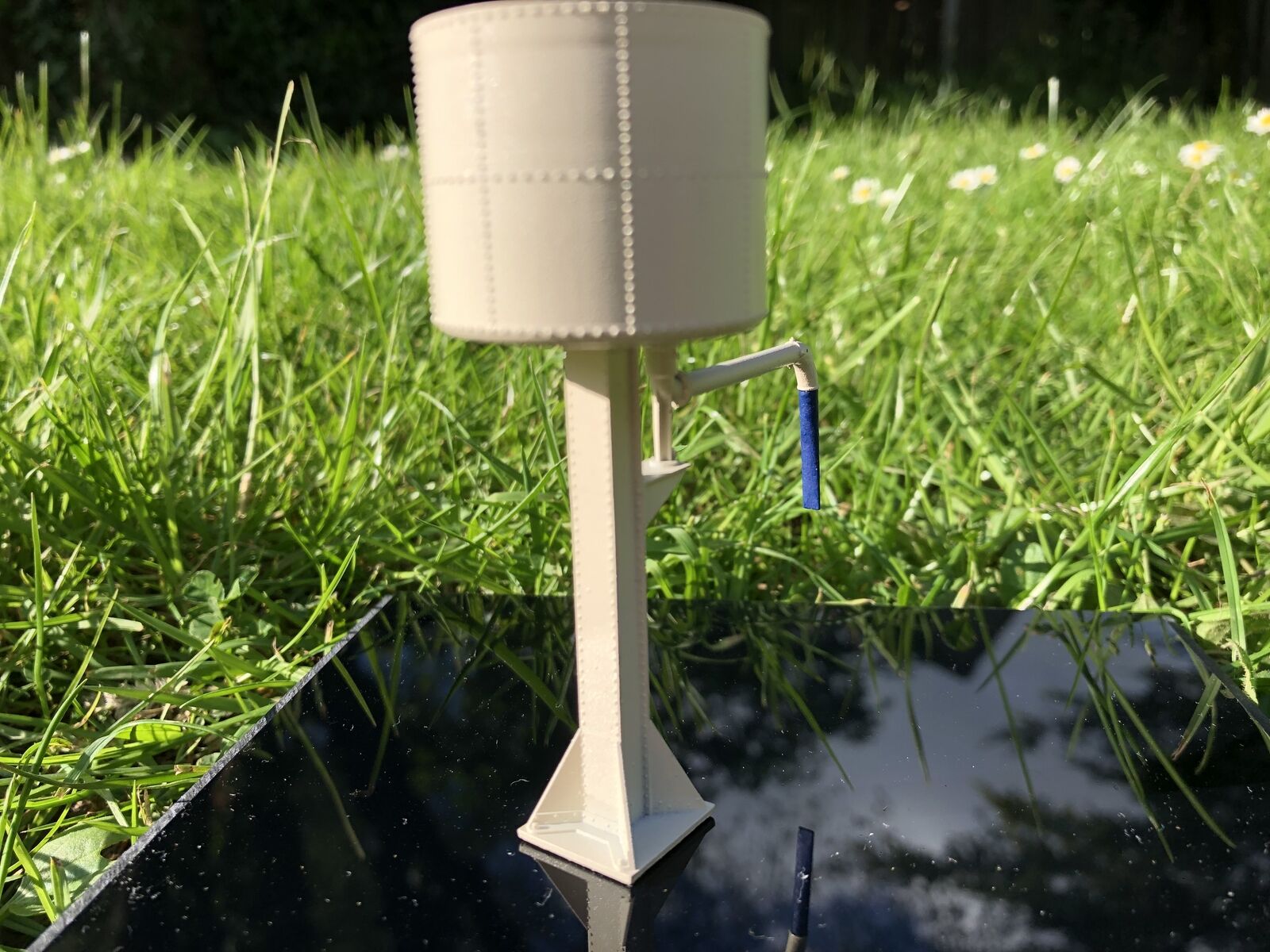 OO9 gauge GWR-style water tower kit based on Buckfastleigh, showing detailed tower stand and tank for model railway layouts