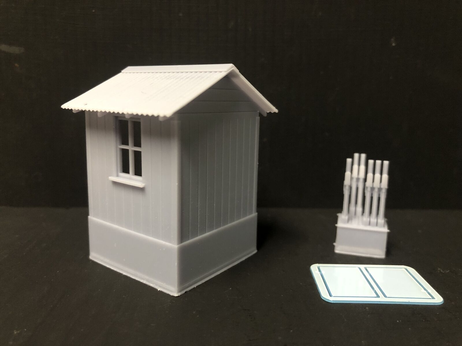 NG7 7mm scale model railway signalman’s hut kit with separate roof, glazing and interior lever frame on a narrow gauge layout