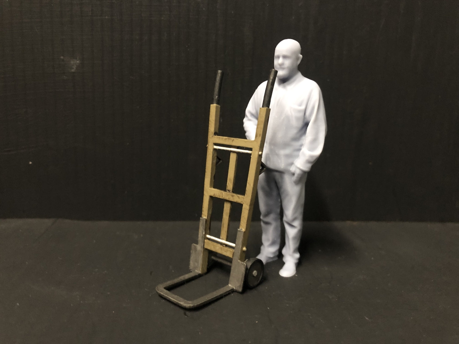 Unpainted GN15 G scale pair of resin sack trolleys for model railway platforms or workshops, shown in grey ready for detailing
