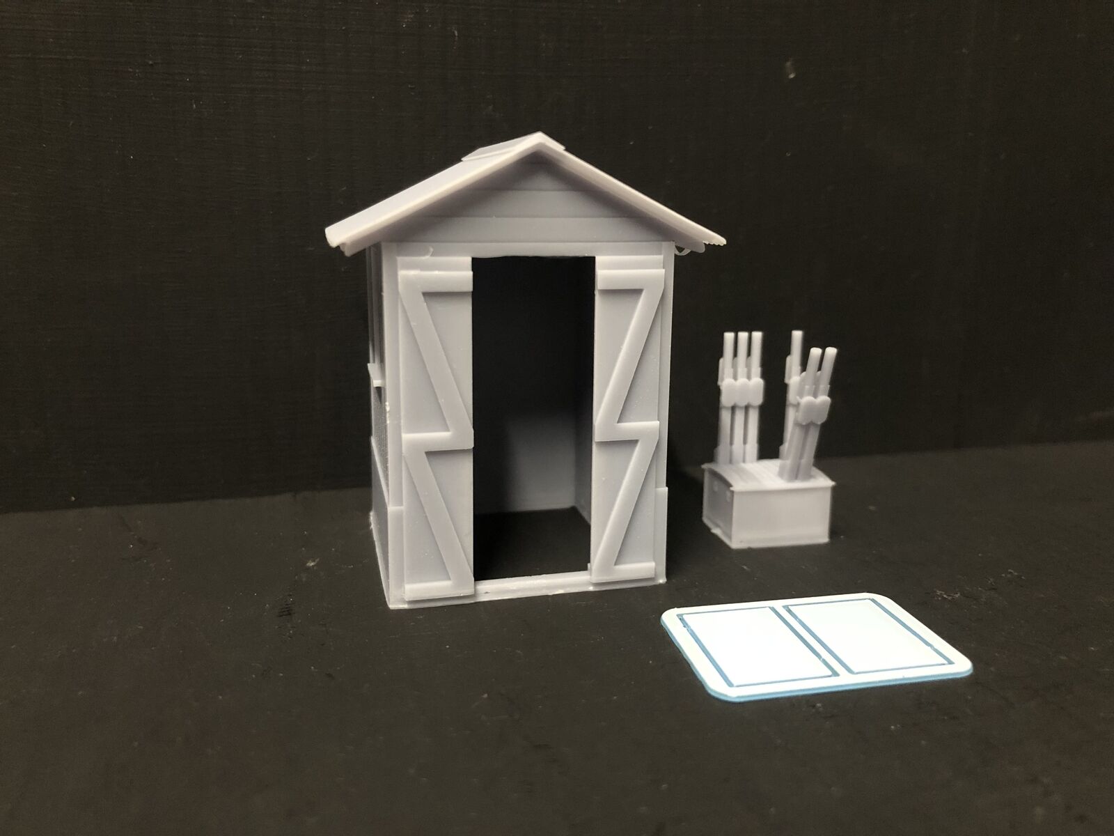 NG7 7mm scale model railway signalman’s hut kit with separate roof, glazing and interior lever frame on a narrow gauge layout