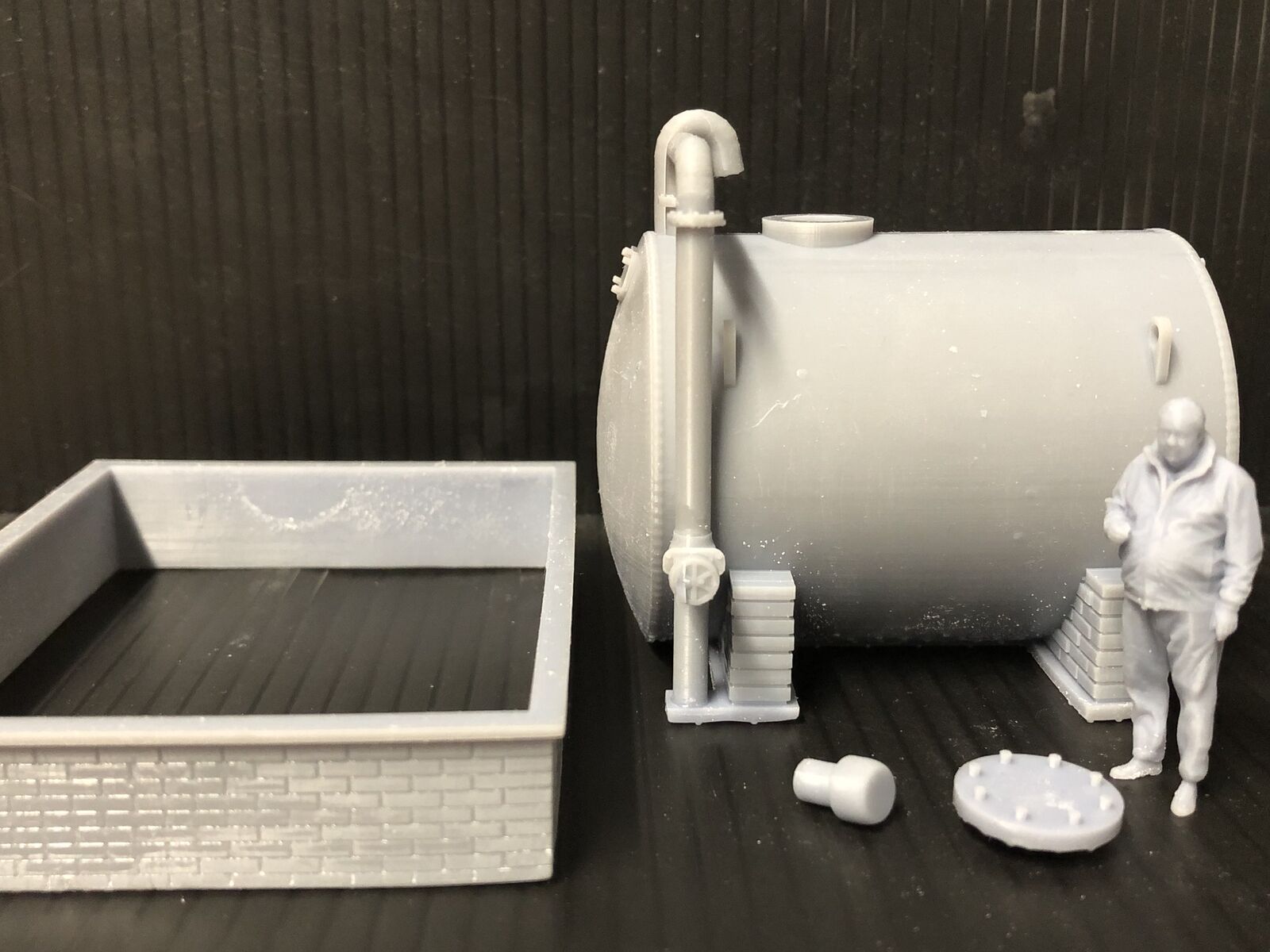 O gauge / O-16.5 7mm scale diesel fuel tank on brick supports with bund wall, ladder, pipework and standing figure for depot scenes