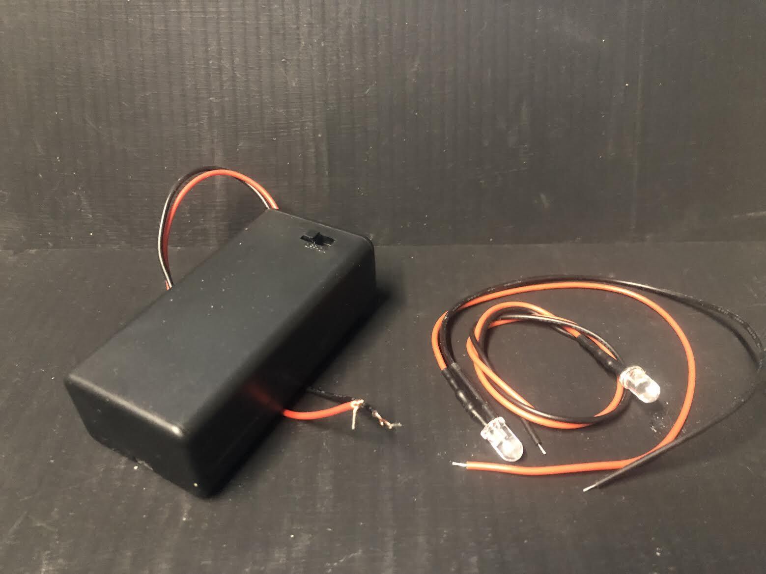 G-scale model railway scenery kit featuring a resin brazier with flickering LEDs and chair, suitable for G and GN15 layouts