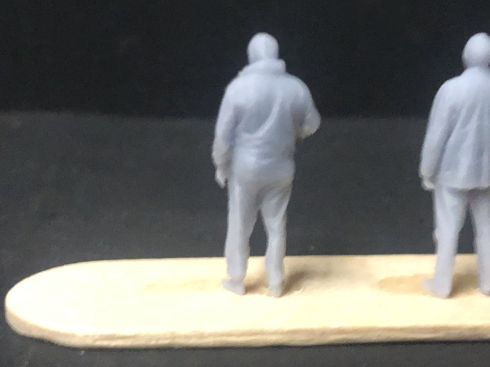 Six unpainted 1:76 scale resin OO9/OO/HO figures in assorted poses for station and layout detailing.