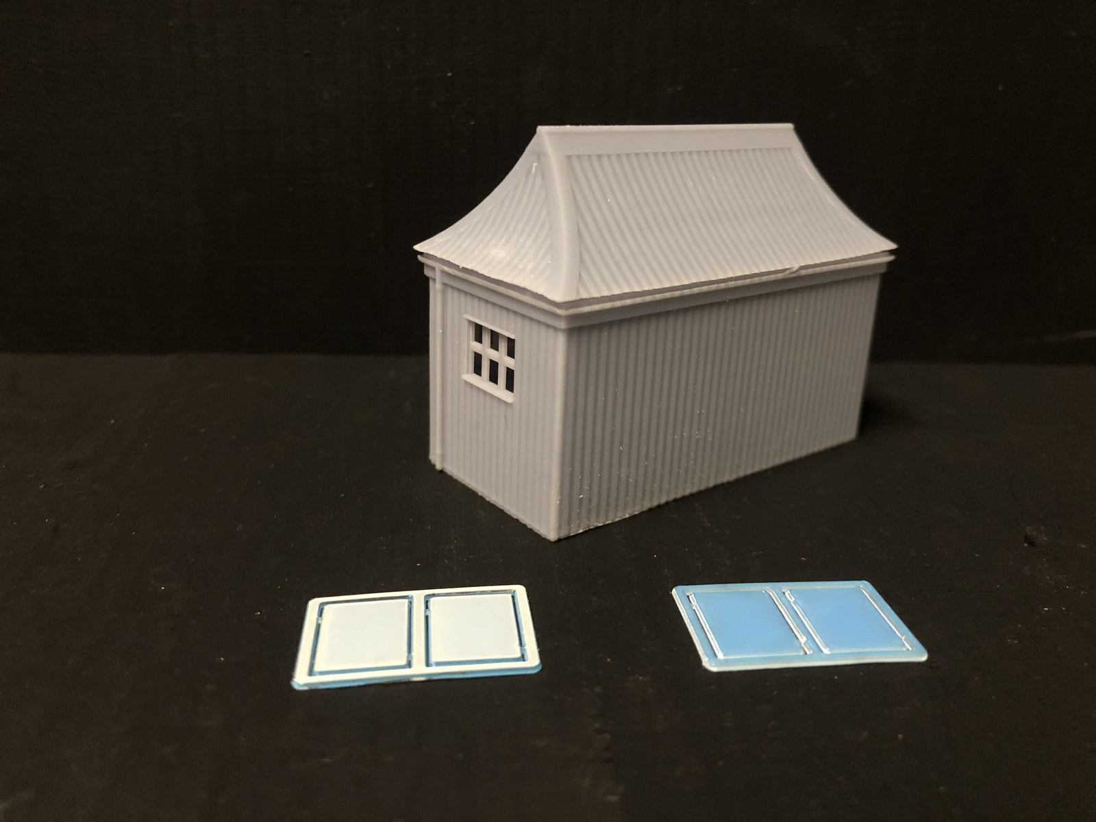 OO9/OO/HO scale GWR pagoda-style waiting room kit with open doors and glazing, based on the Glyndyfrdwy station building