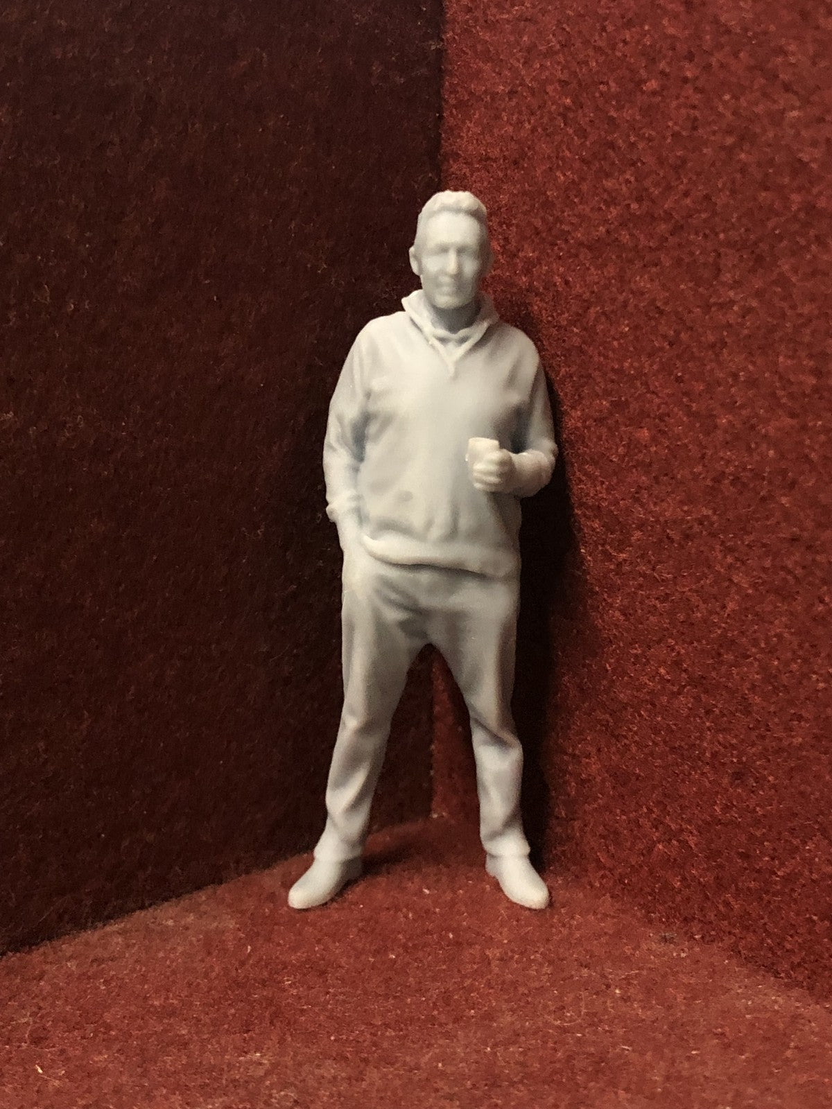 Unpainted G-scale 1:22.5 male model railway figure holding a coffee cup, 3D scanned from a real person for realistic detail