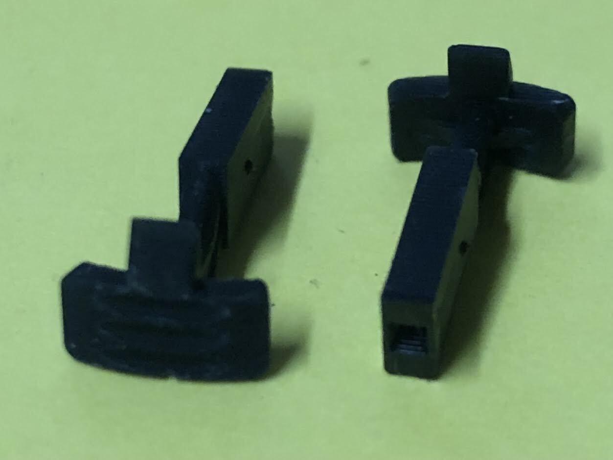 Four pairs of OO9 narrow gauge hook couplings designed to fit Kato 11-105 chassis, shown loose and ready for model railway use.