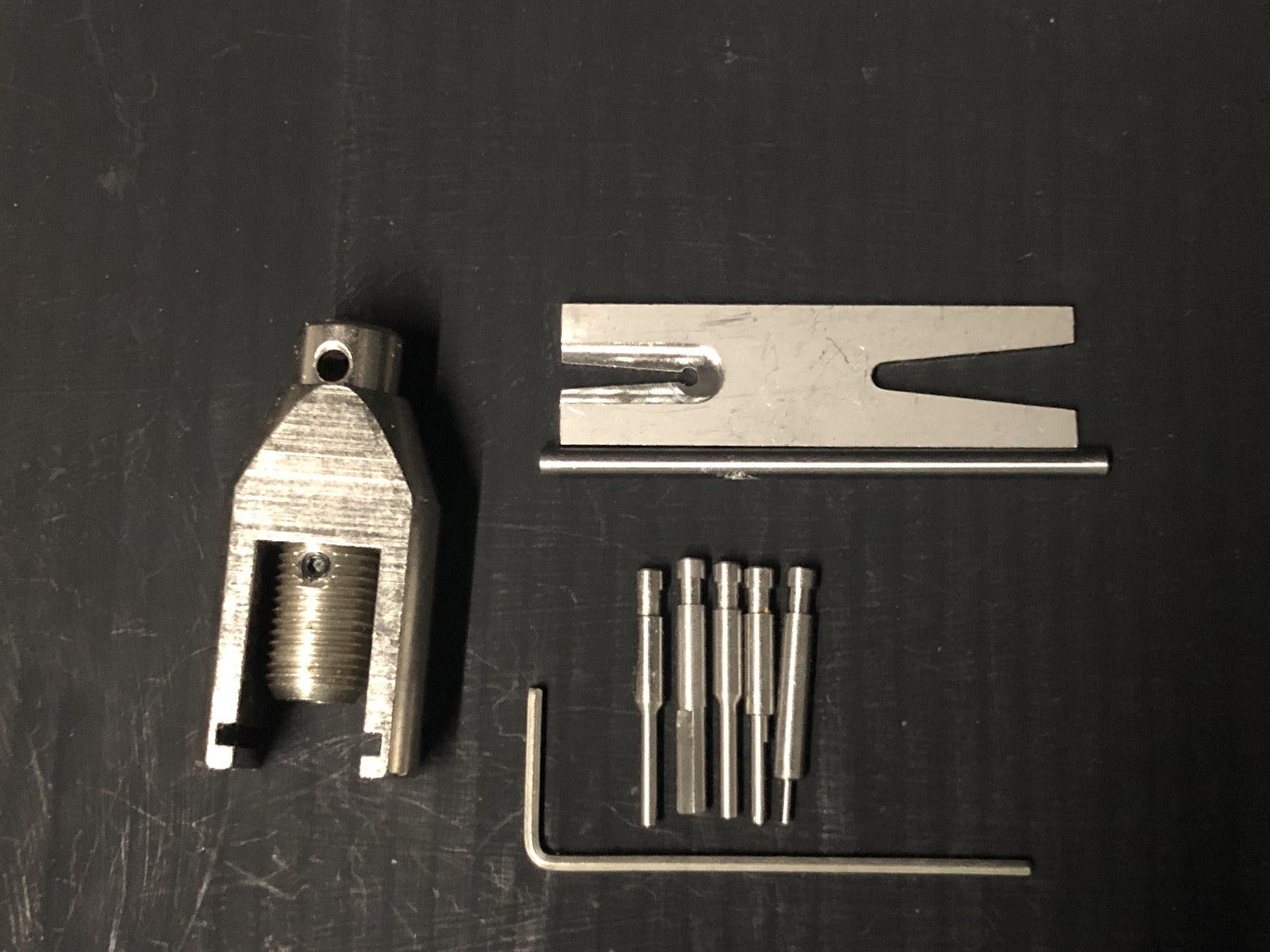 Gear puller tool set for Hornby model train motors, with multiple pin sizes for removing small locomotive gears