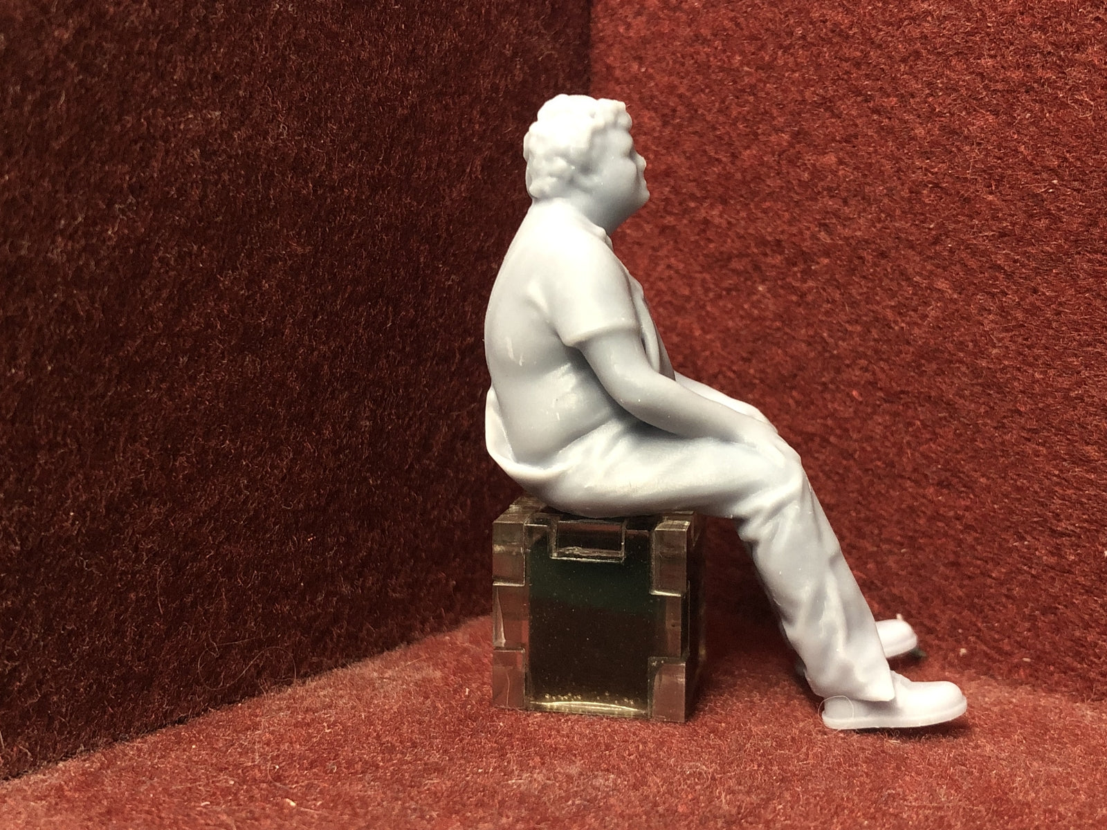Unpainted 3D-printed seated driver figure in G scale 1:22.5, suitable for GN15 model railway layouts.