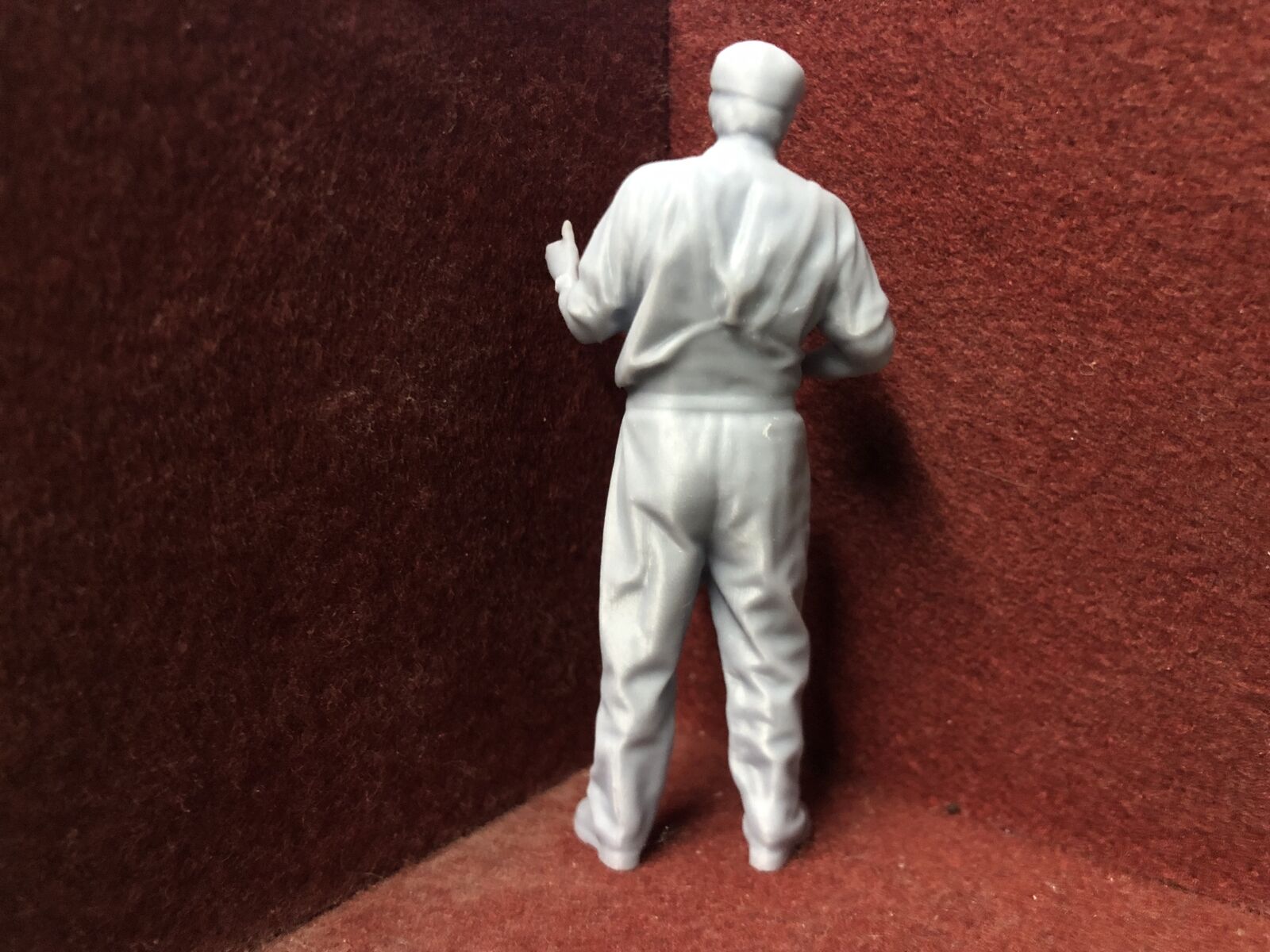 Unpainted 16mm 1:19 scale SM32 driver figure in flat cap giving a thumbs up for garden railway layouts