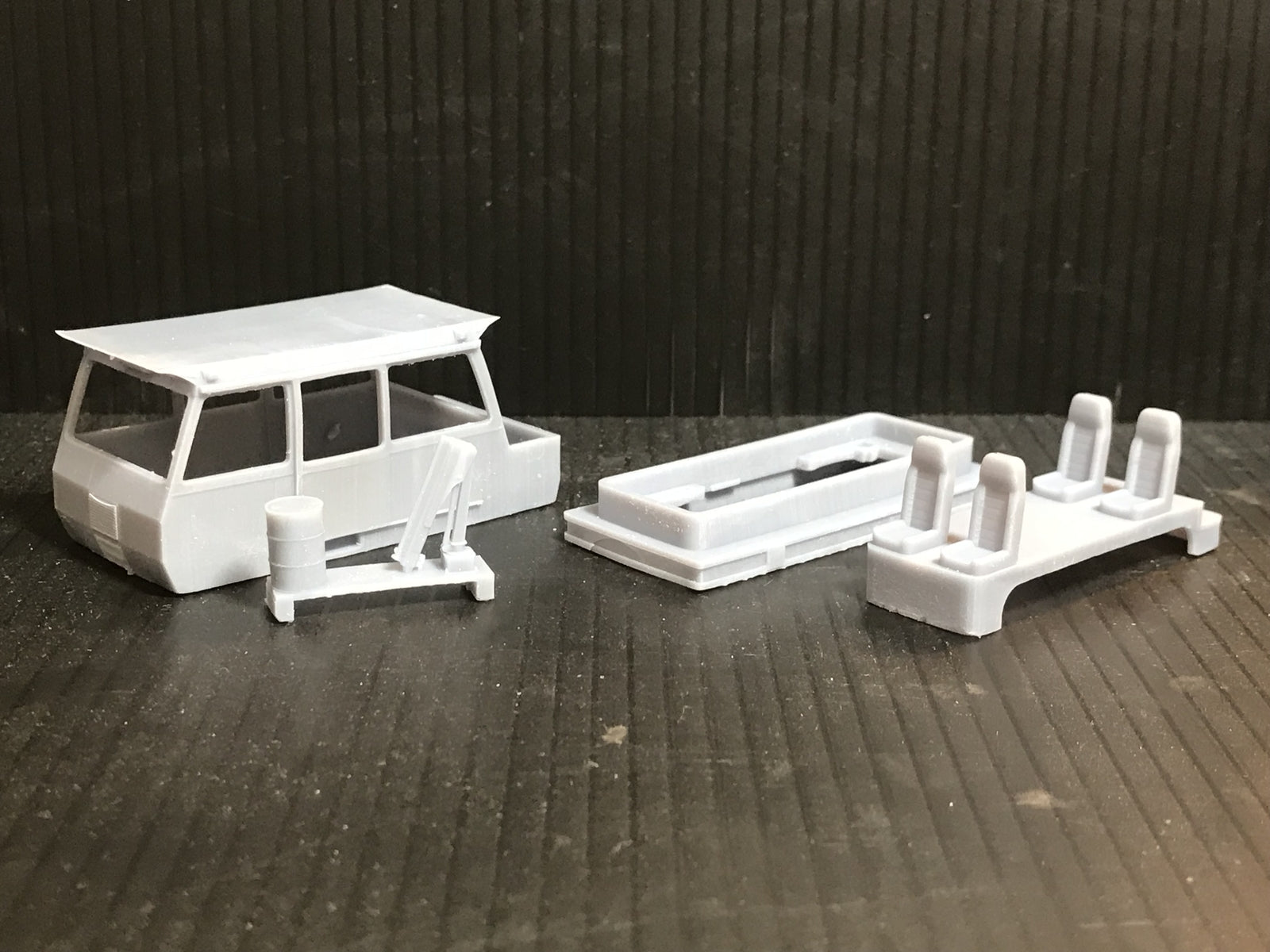 Unpainted OO9 narrow gauge Wickham inspection car body kit with interior for Kato 11-109 chassis, shown ready for assembly