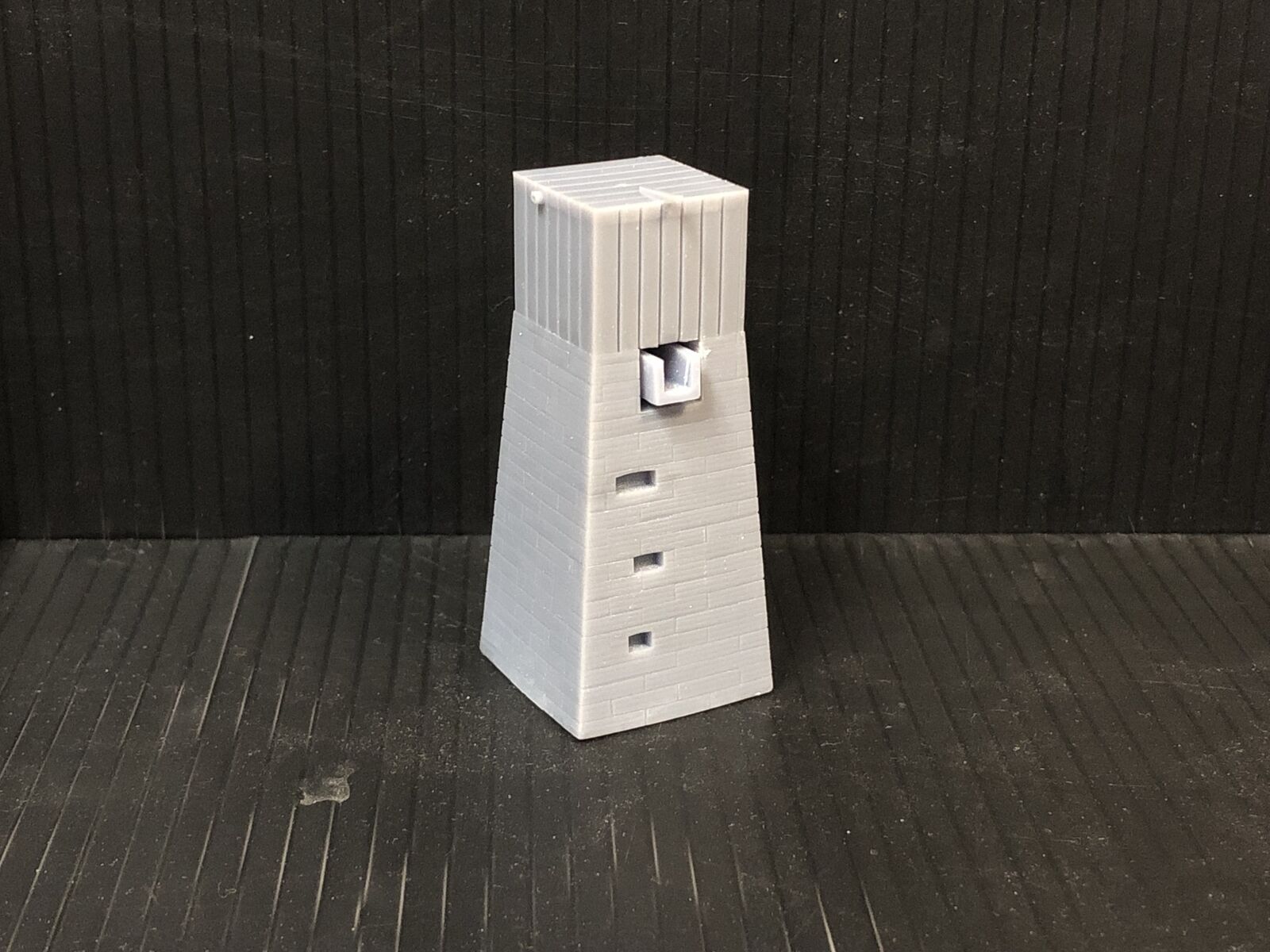 OO9 gauge Dolgoch-style model railway water tower kit with slate brick tower and top-mounted tank