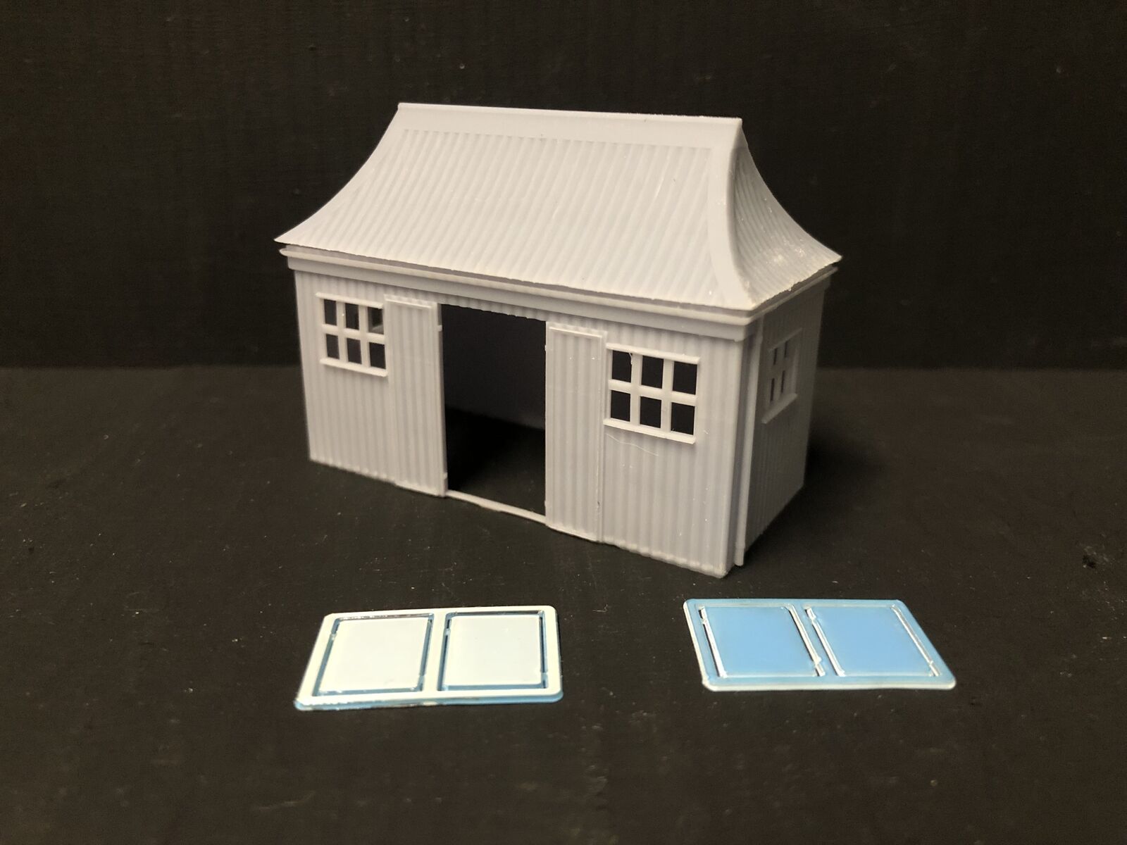 OO9/OO/HO scale GWR pagoda-style waiting room kit with open doors and glazing, based on the Glyndyfrdwy station building