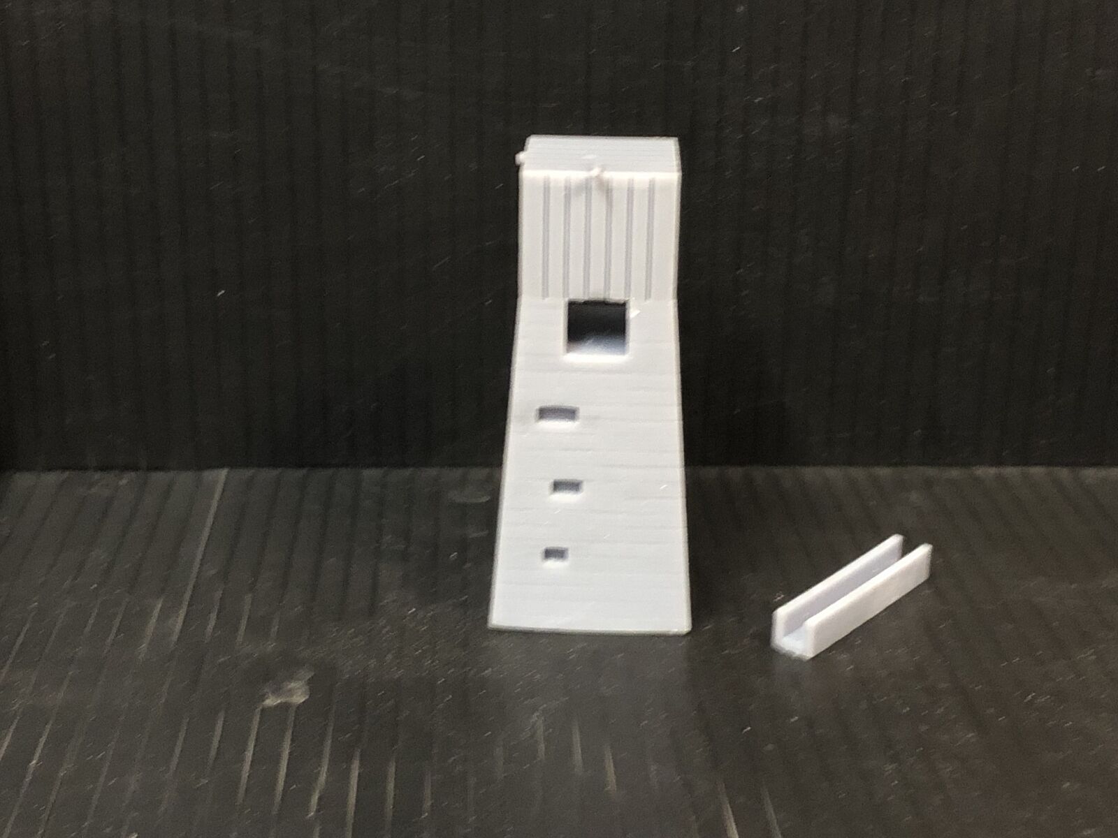 OO9 gauge Dolgoch-style model railway water tower kit with slate brick tower and top-mounted tank