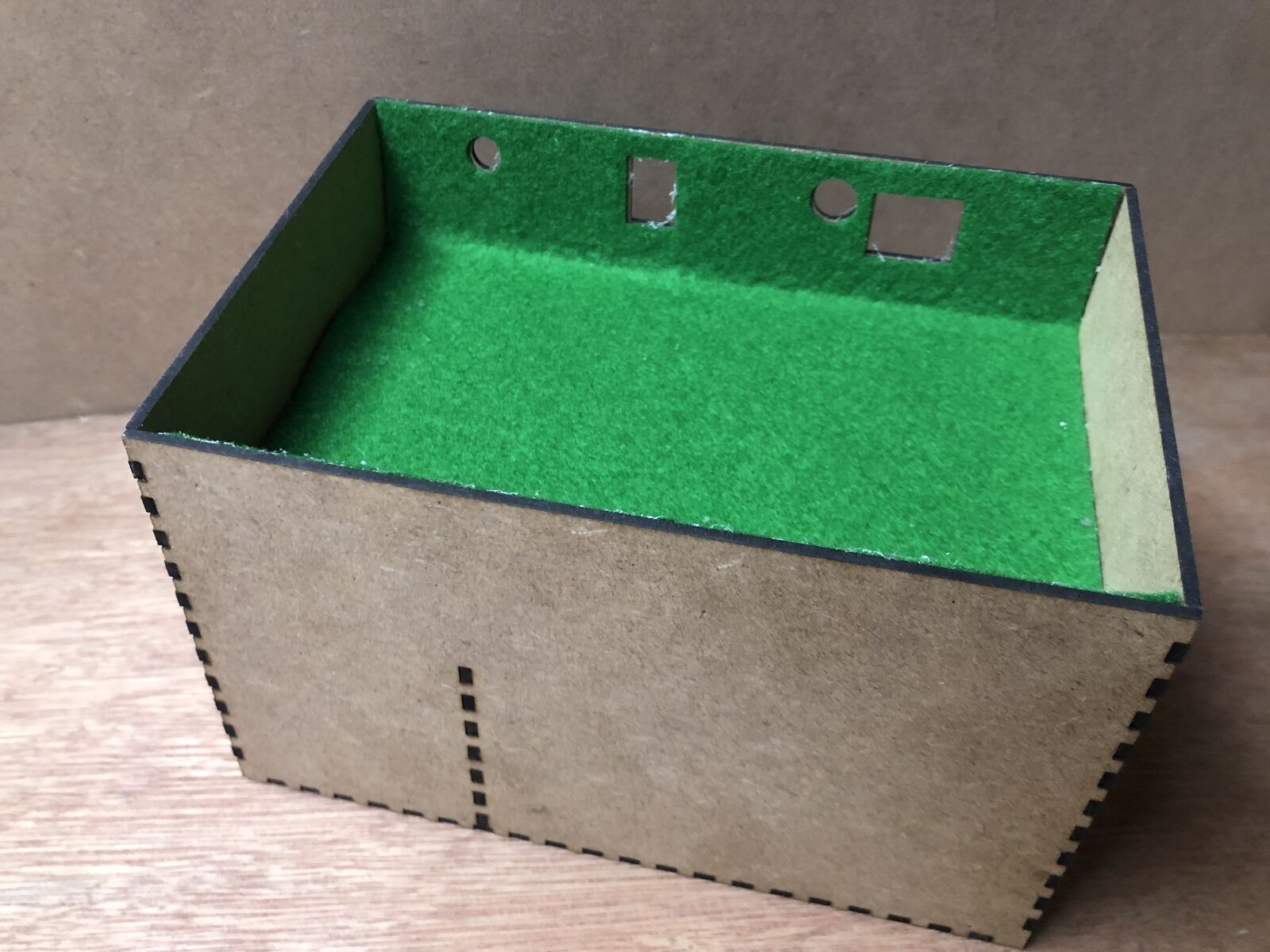 Desktop stand and tidy kit holding a Bachmann EZ DCC model railway controller with space below for power brick and leads