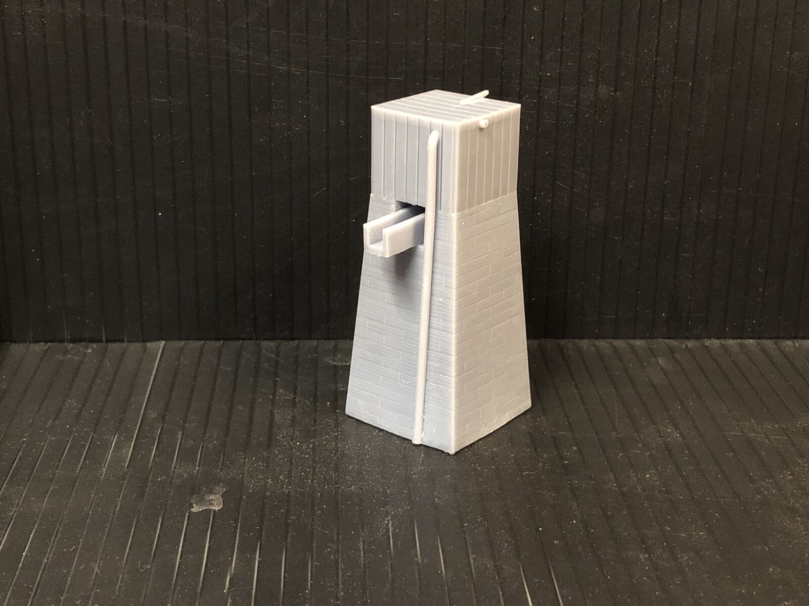 OO9 narrow gauge Dolgoch-style water tower kit with slate brick tower and top-mounted water tank for OO gauge model railways