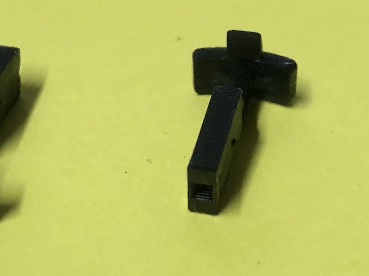 Set of four pairs of OO9 narrow gauge hook couplings designed to fit Kato 11-105 model railway chassis holders.