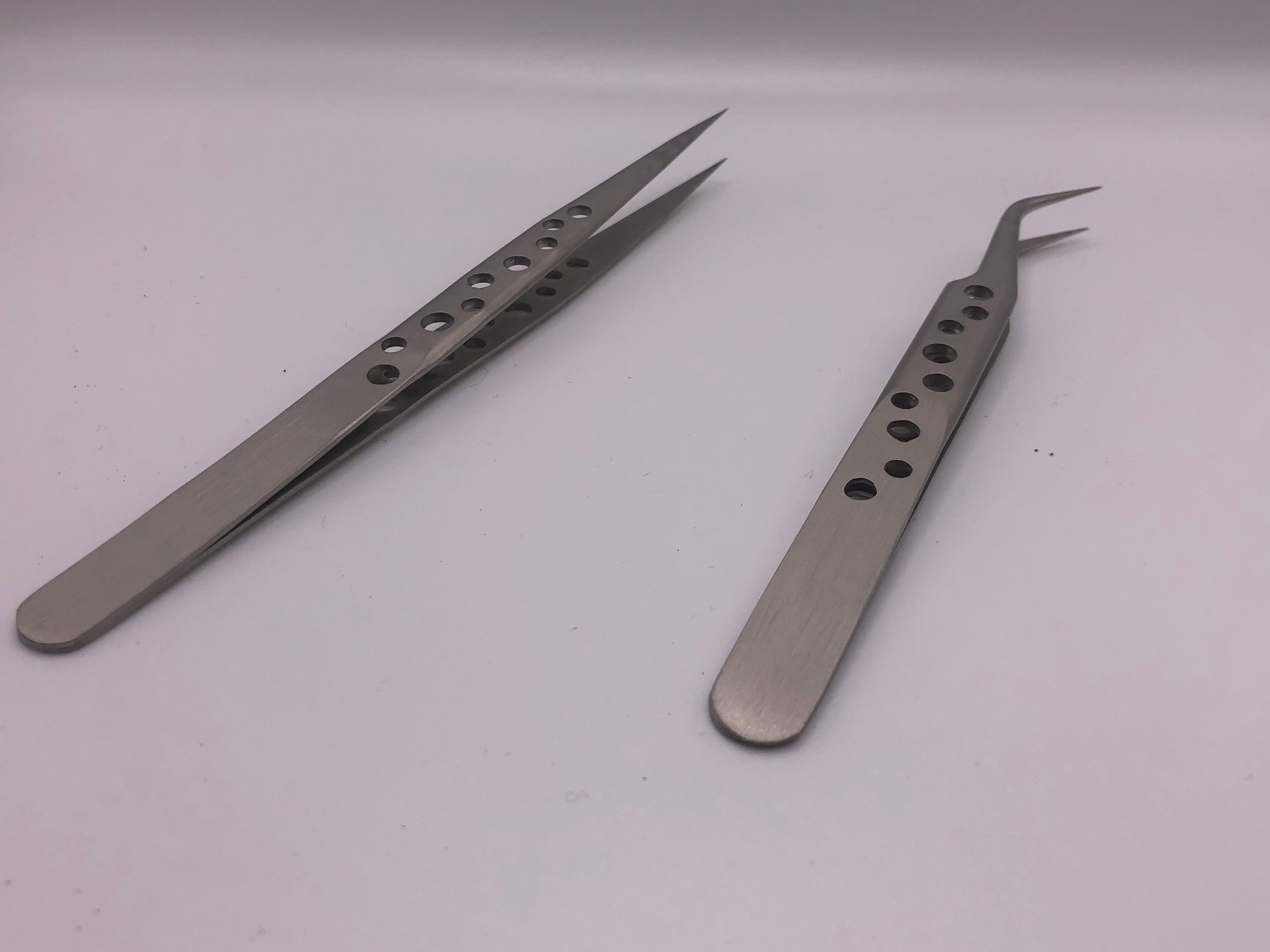 Pair of precision stainless steel tweezers with straight and curved fine tips, drilled anti-static handles for detailed modelling work