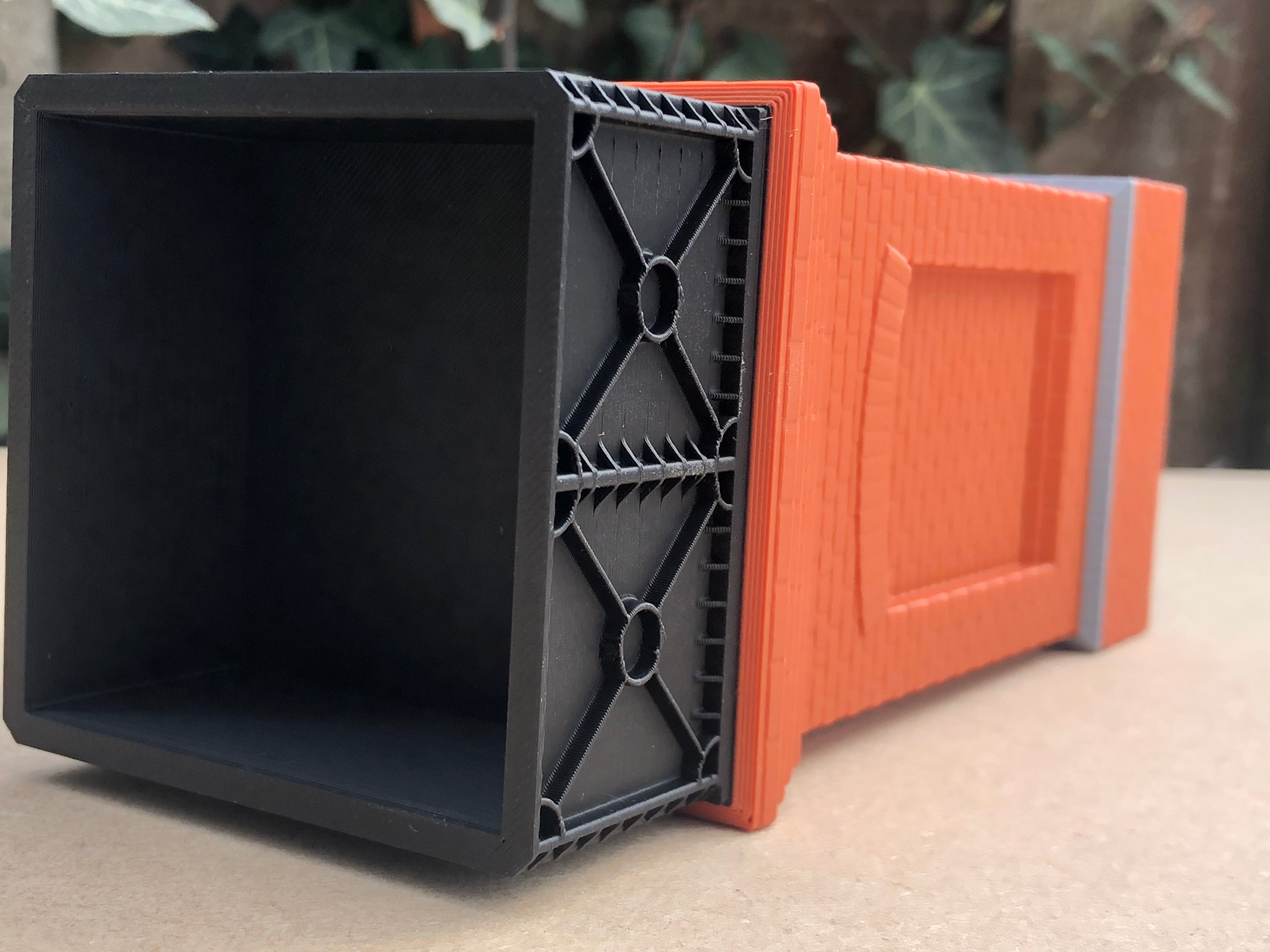 Unpainted but pre-coloured small brick water tower model for G Gauge or GN15 layouts, 3D printed in brick, grey and black PLA