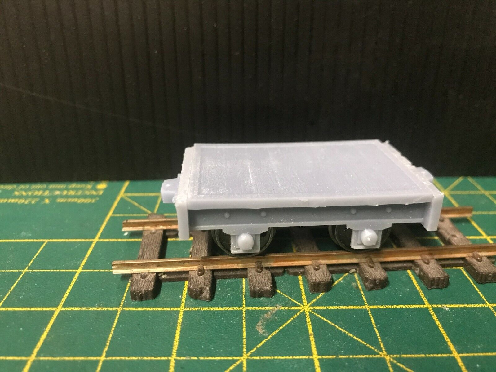 Gn15 narrow gauge flat wagon kit shown assembled on 16.5mm track with optional 12.5mm wheelset displayed alongside