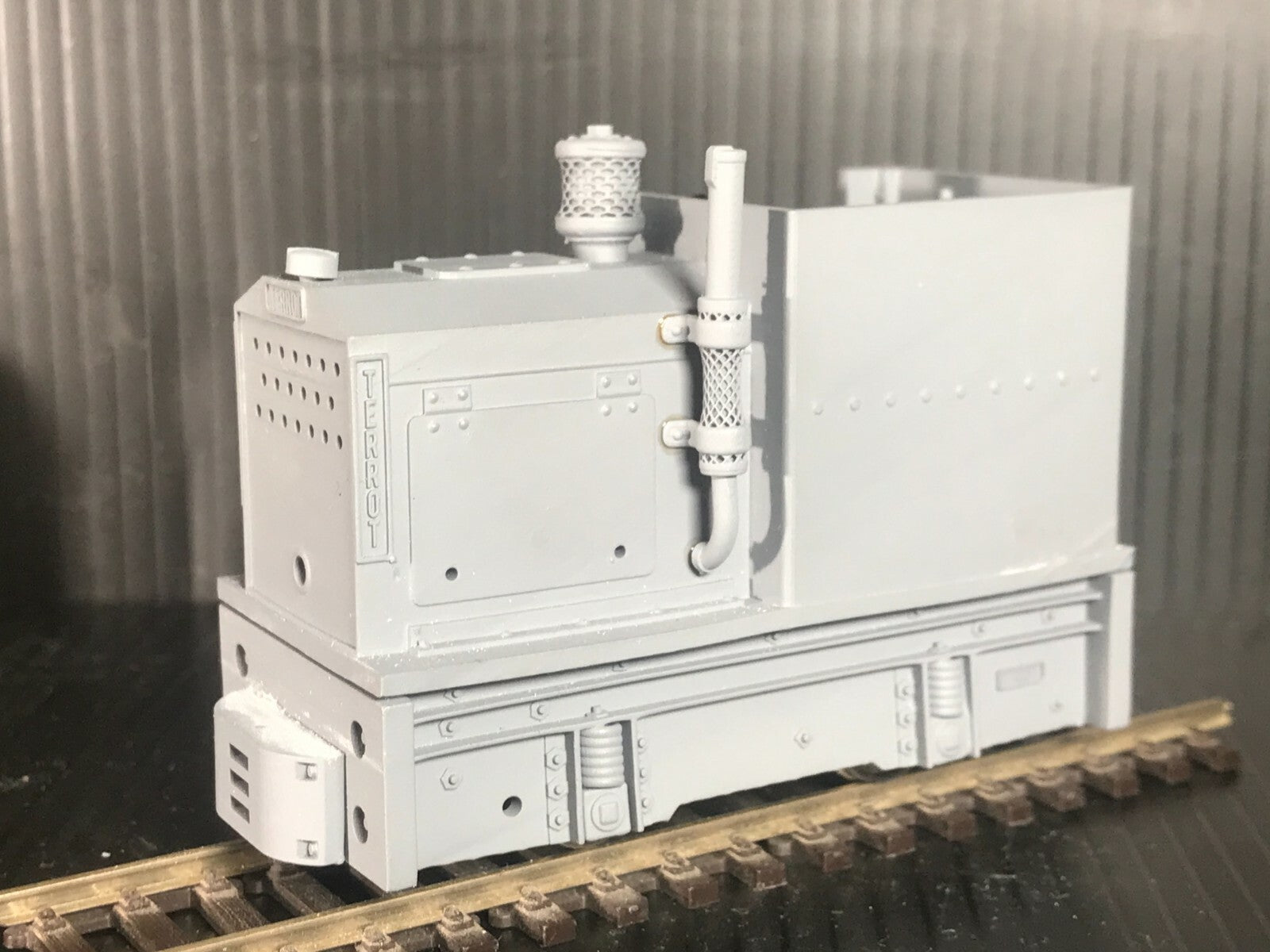 Unpainted GN15 diesel critter locomotive kit in G scale for 00 gauge track, shown on a Tenshodo spud motor bogie chassis