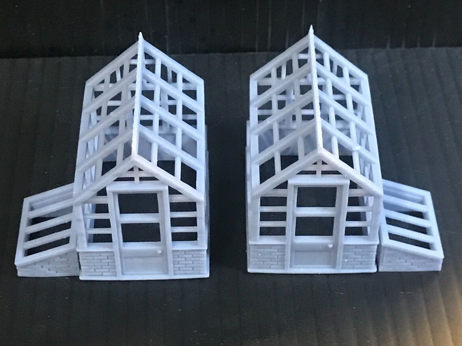Unpainted 00 gauge Victorian-style model railway kit with two resin greenhouses and two cold frames, ready to assemble and paint
