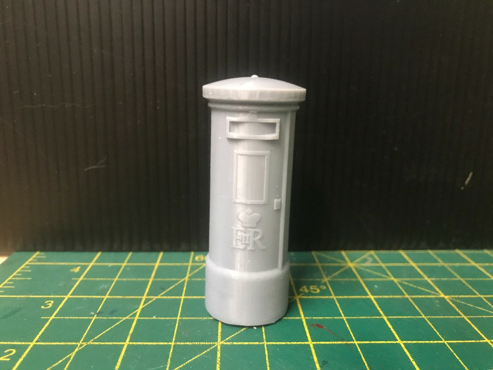 Unpainted G-scale and GN15 model postbox scenery set for narrow gauge railway layouts, including freestanding and wall-mounted boxes