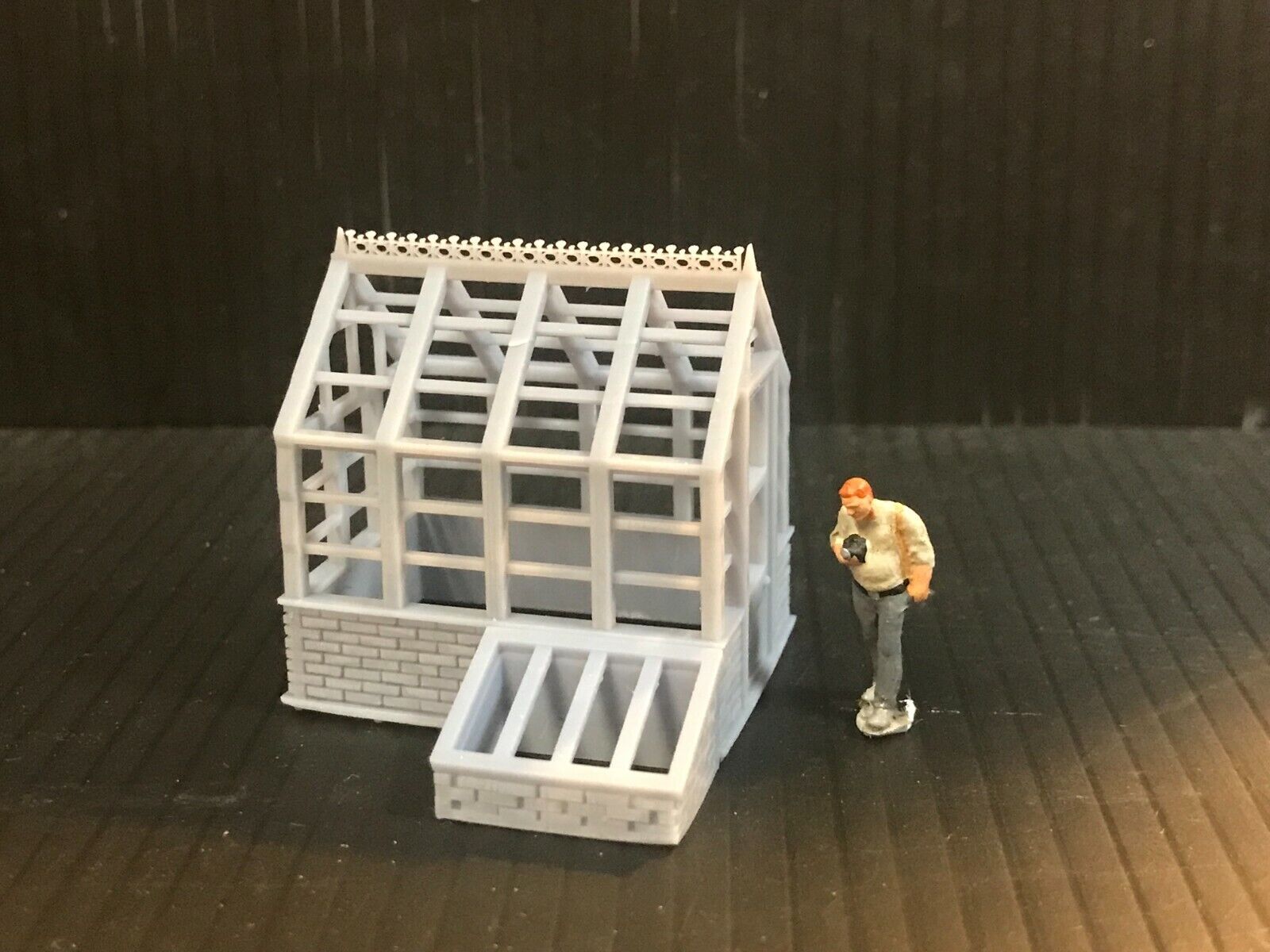Unpainted 00 gauge Victorian-style model railway kit with two resin greenhouses and two cold frames, ready to assemble and paint