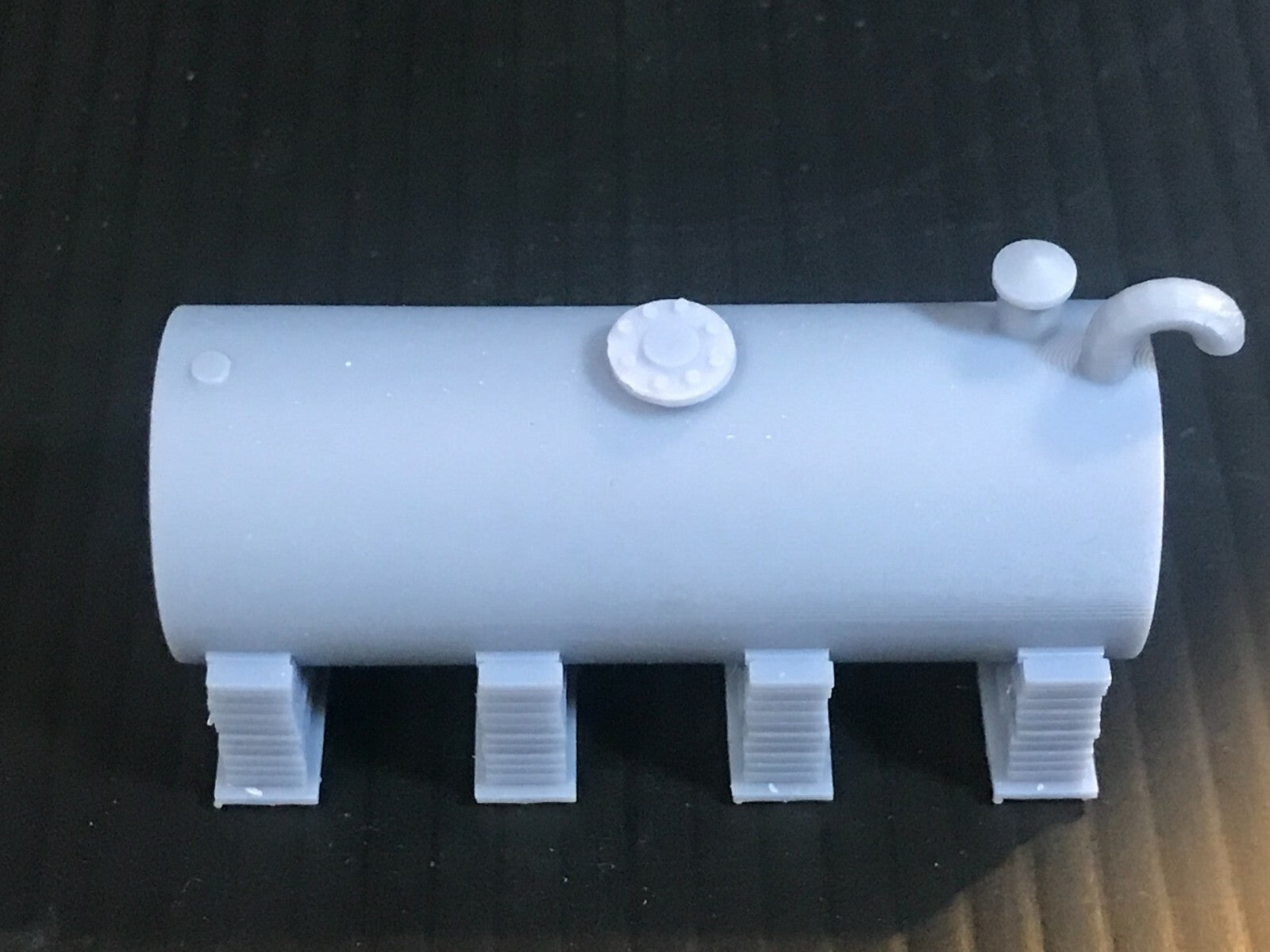 Unpainted OO/HO/OO9 gauge single diesel depot tank on brick supports model kit, ready for priming and painting